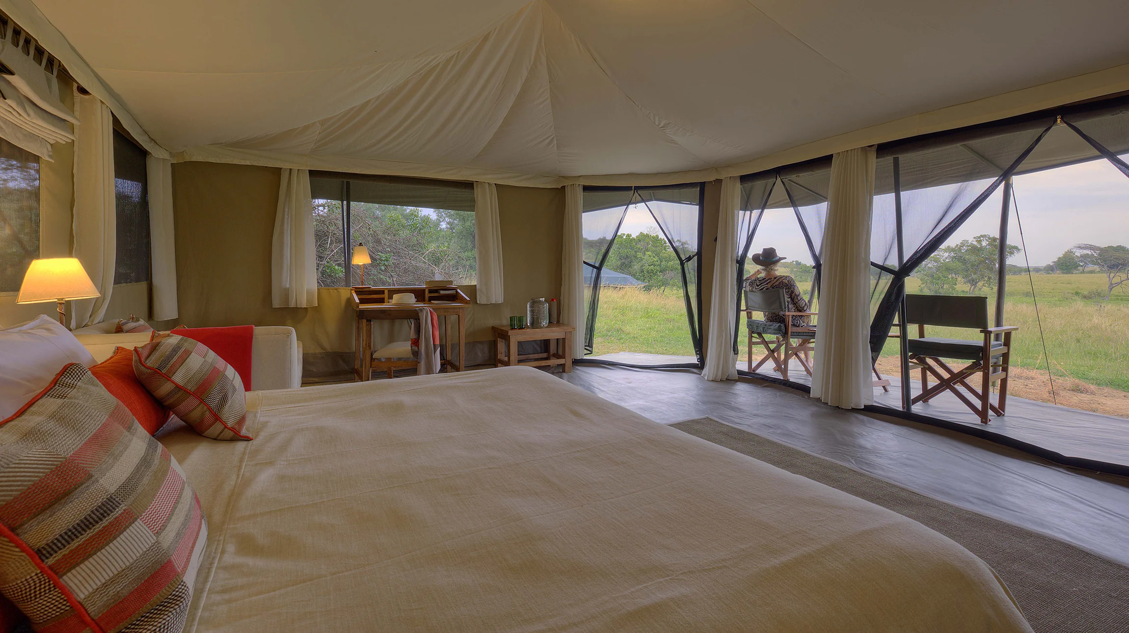 A tent bedroom looking out to the plains