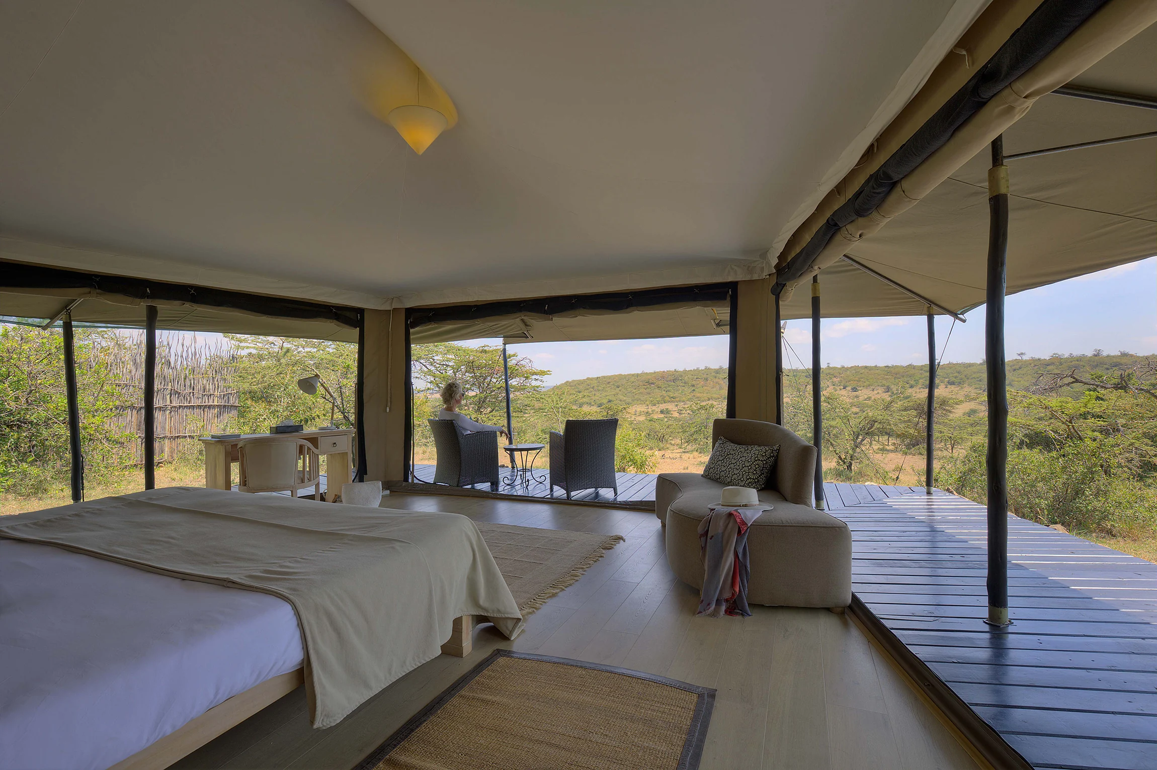A tent bedroom opening onto its deck