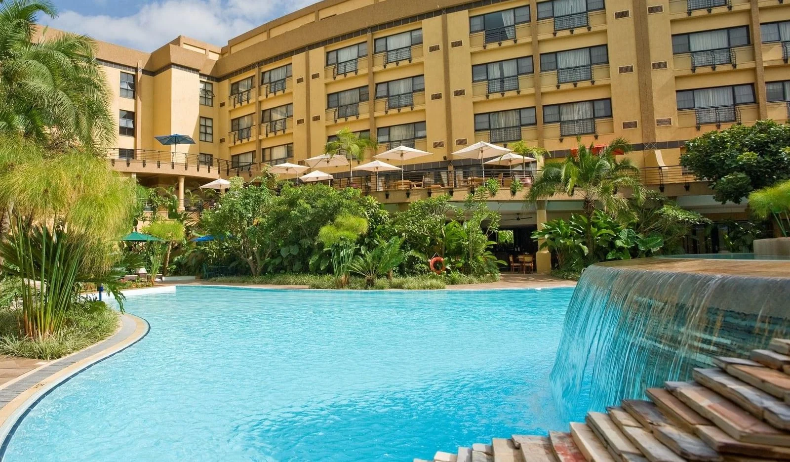 The pool and gardens in front of the hotel