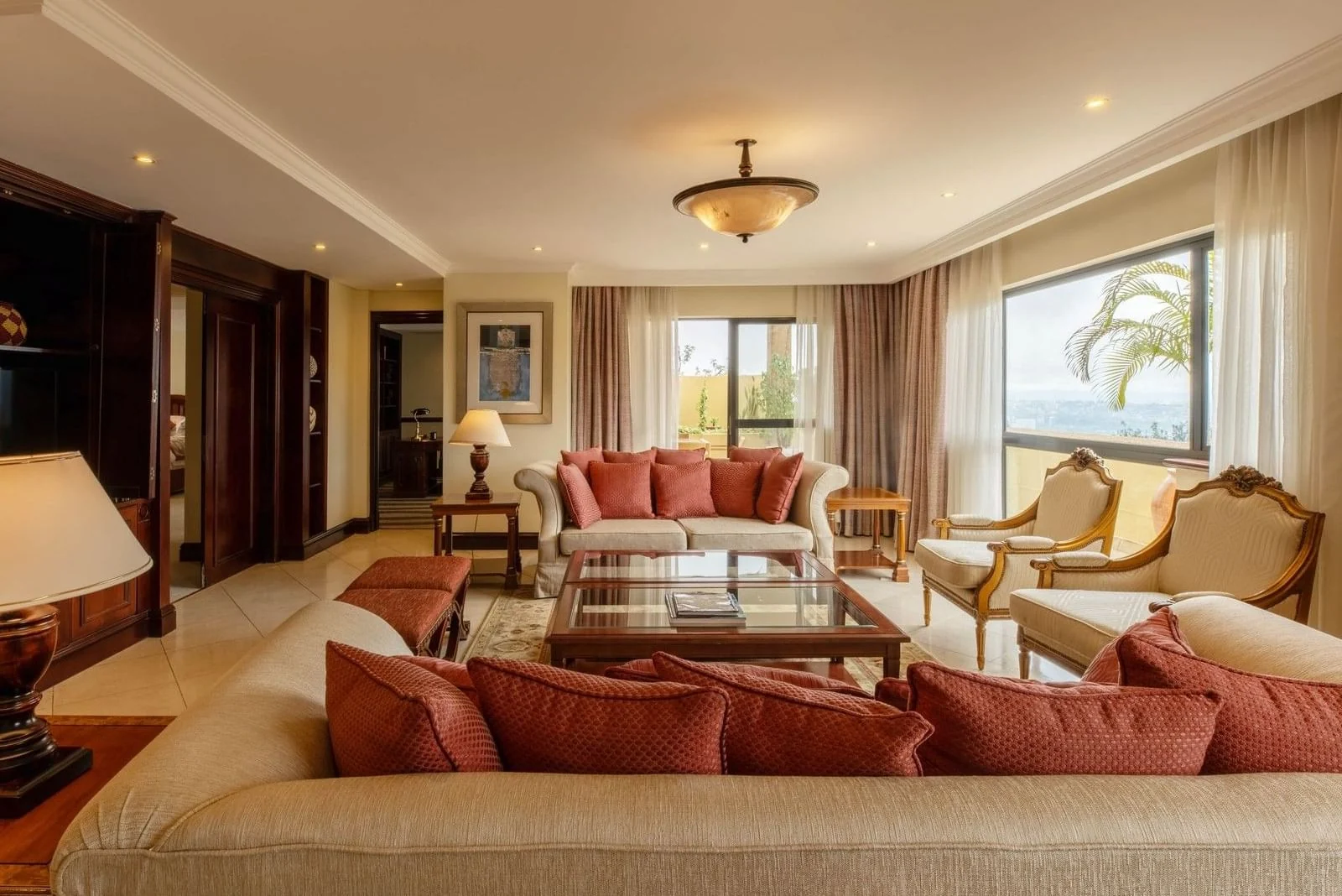 A suite sitting room with sofas and armchairs