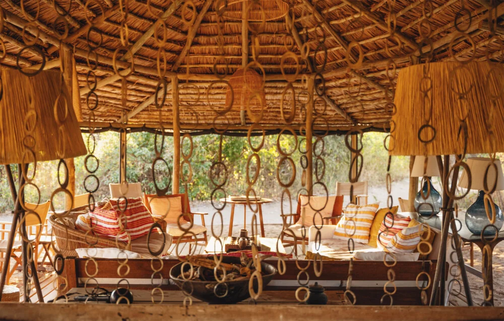 The lounge under a thatched roof with hanging seed pods