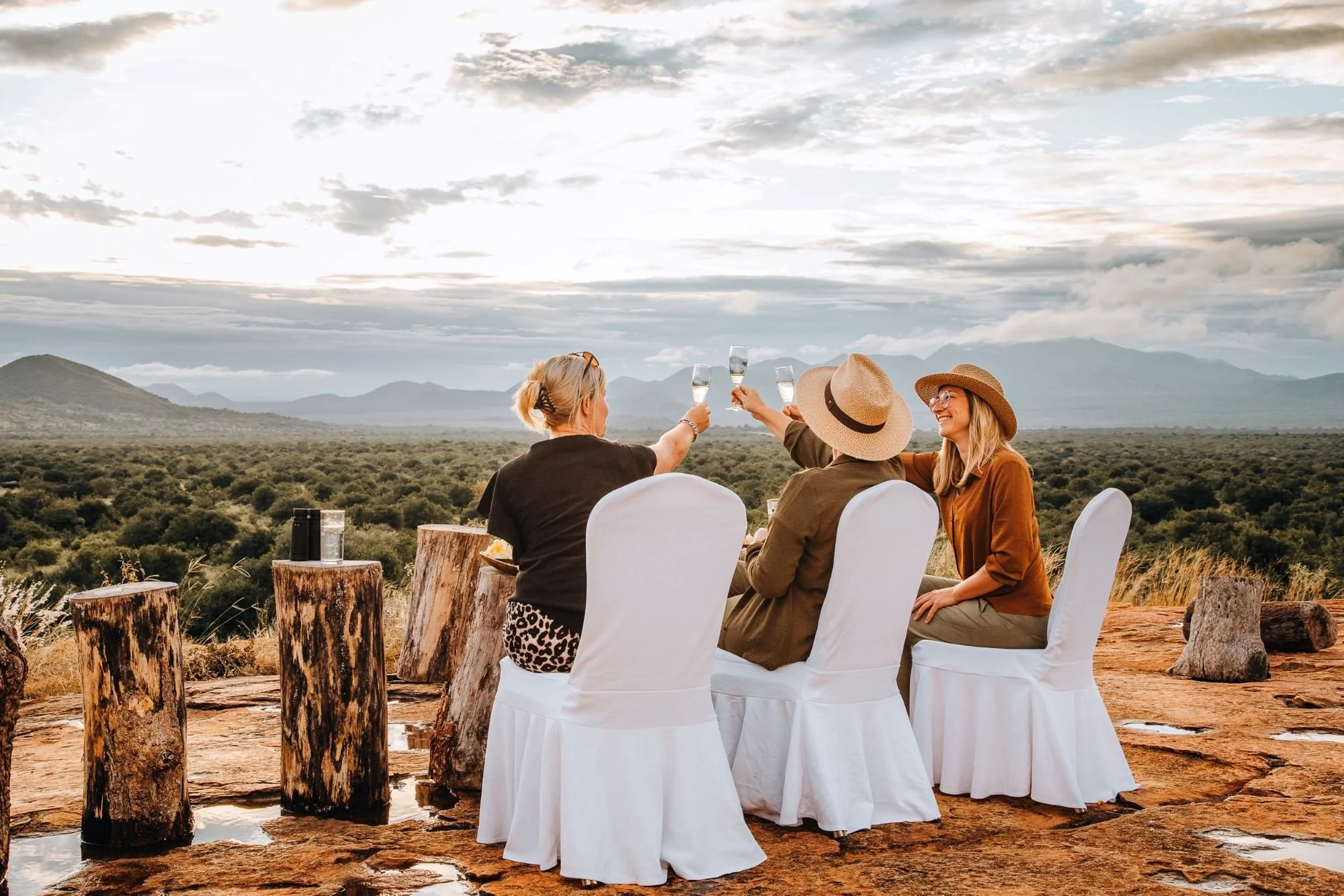 Sundowners on the rocks with the hills beyond