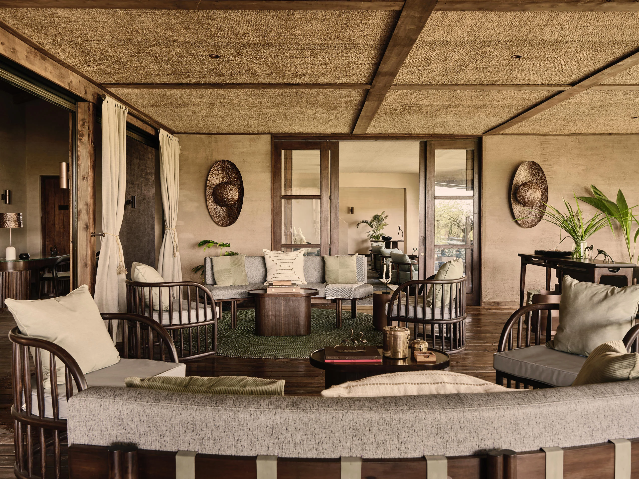 The lounge with armchairs and the plains beyond