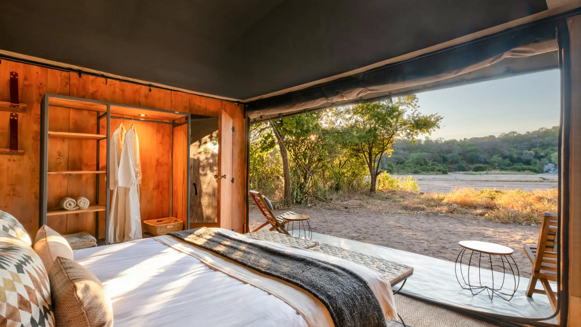 A tent bedroom looking out to the plains