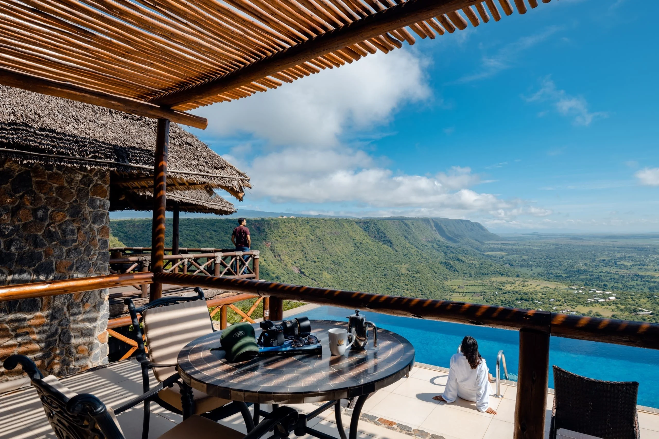A table on the terrace beside the pool, looking over the Rift Valley