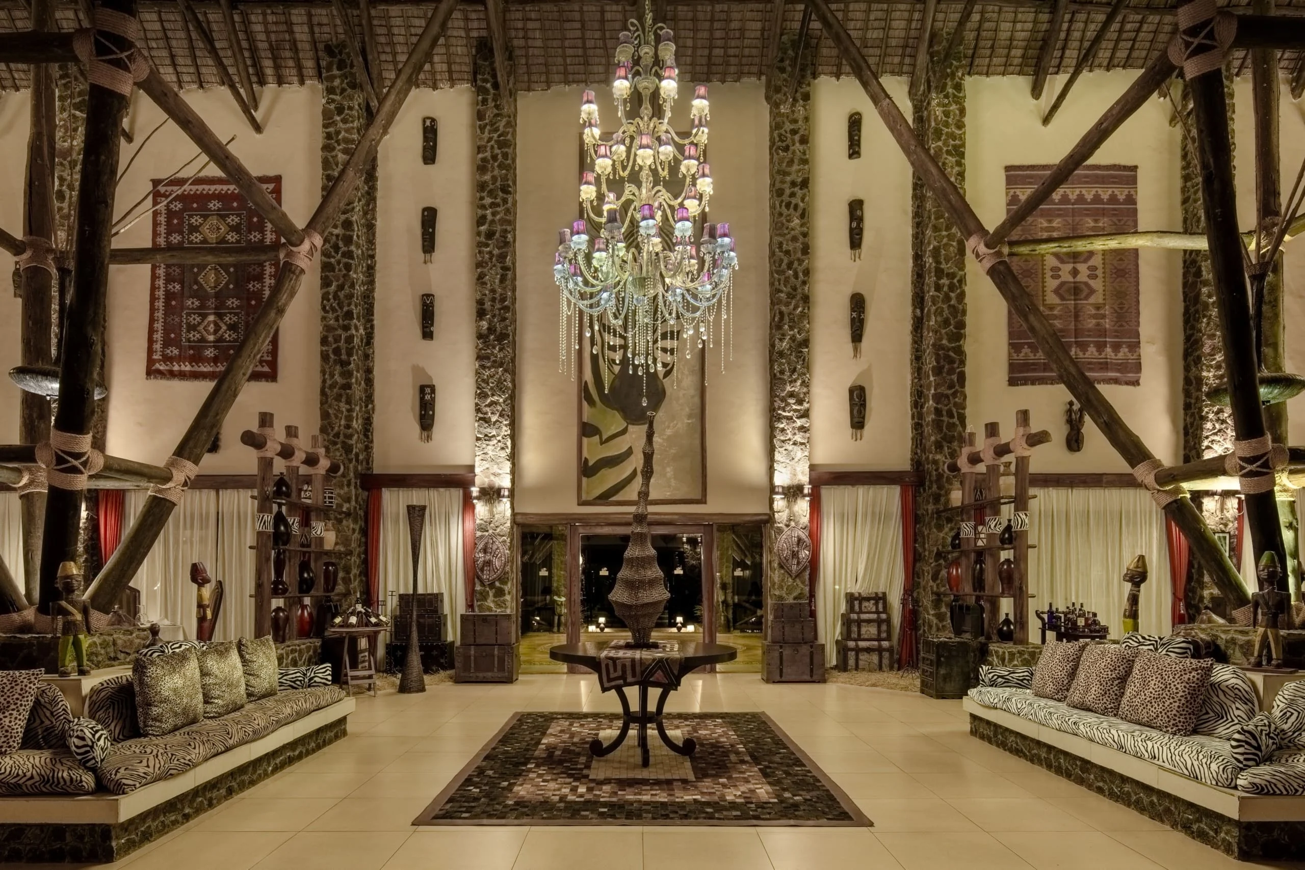 The lounge with a chandelier and patterned rugs