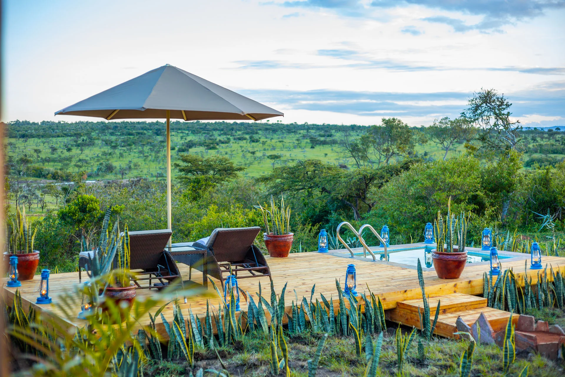 The pool terrace under a parasol