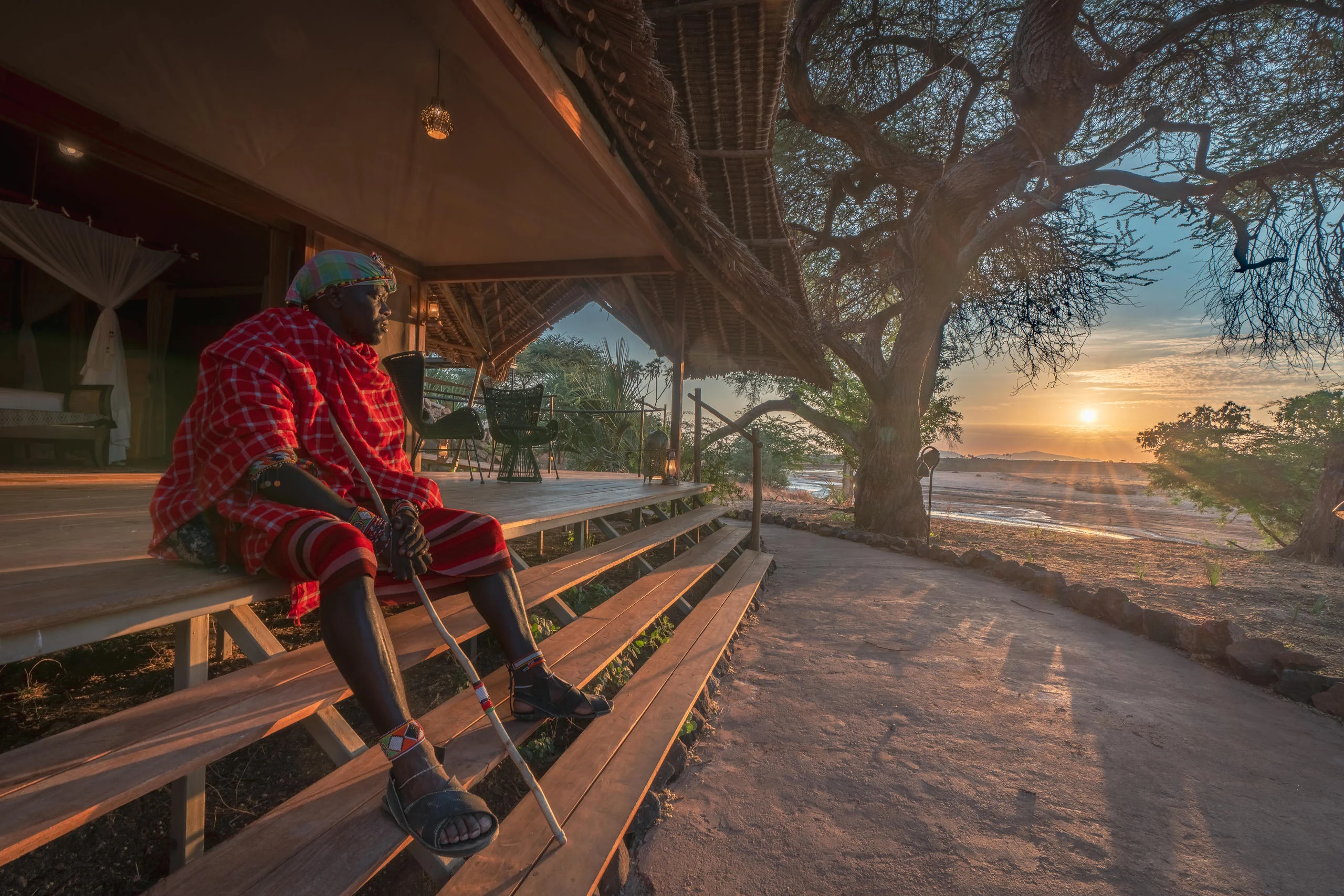 A Samburu guide on the deck at sunrise