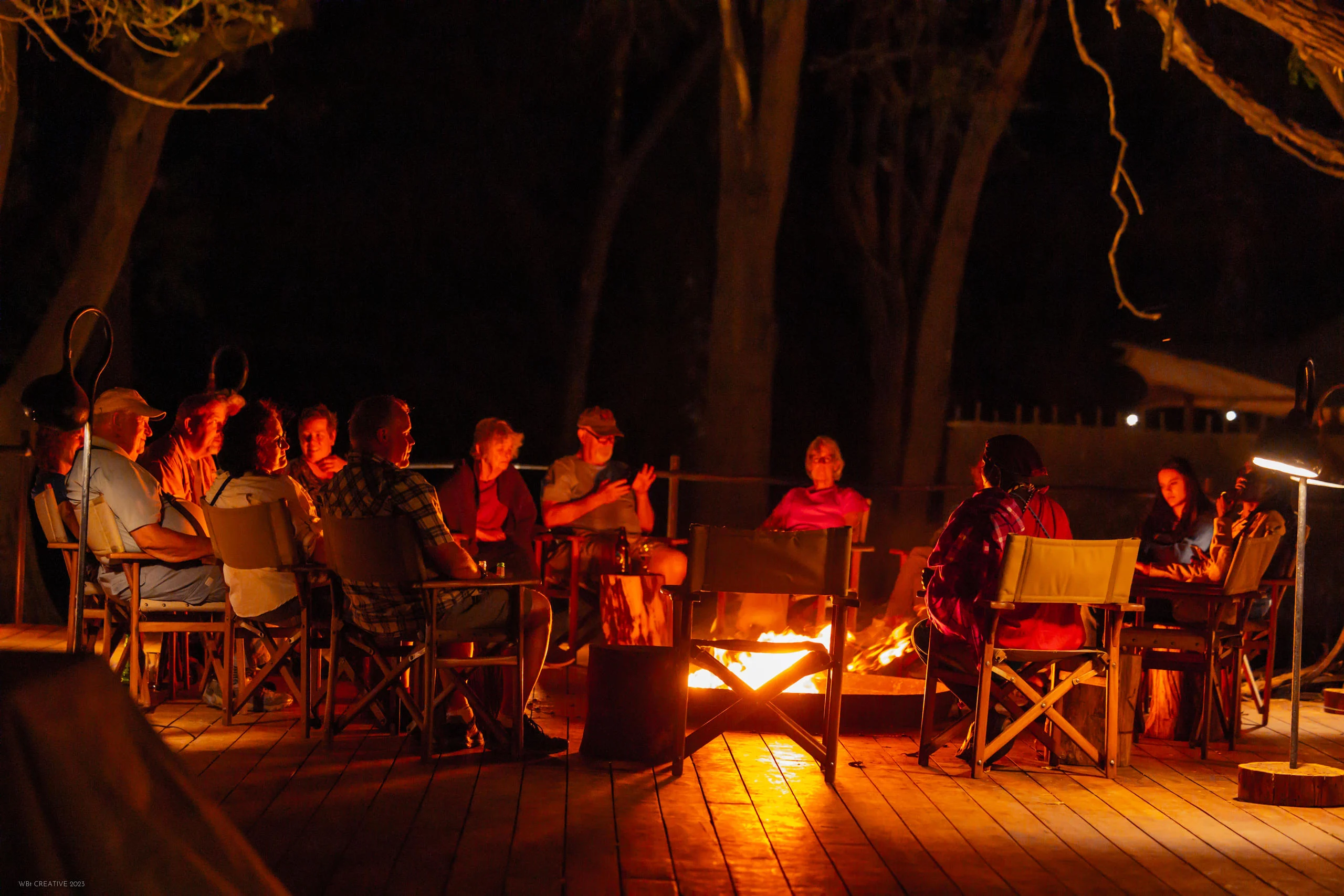 Guests around the fire in the evening