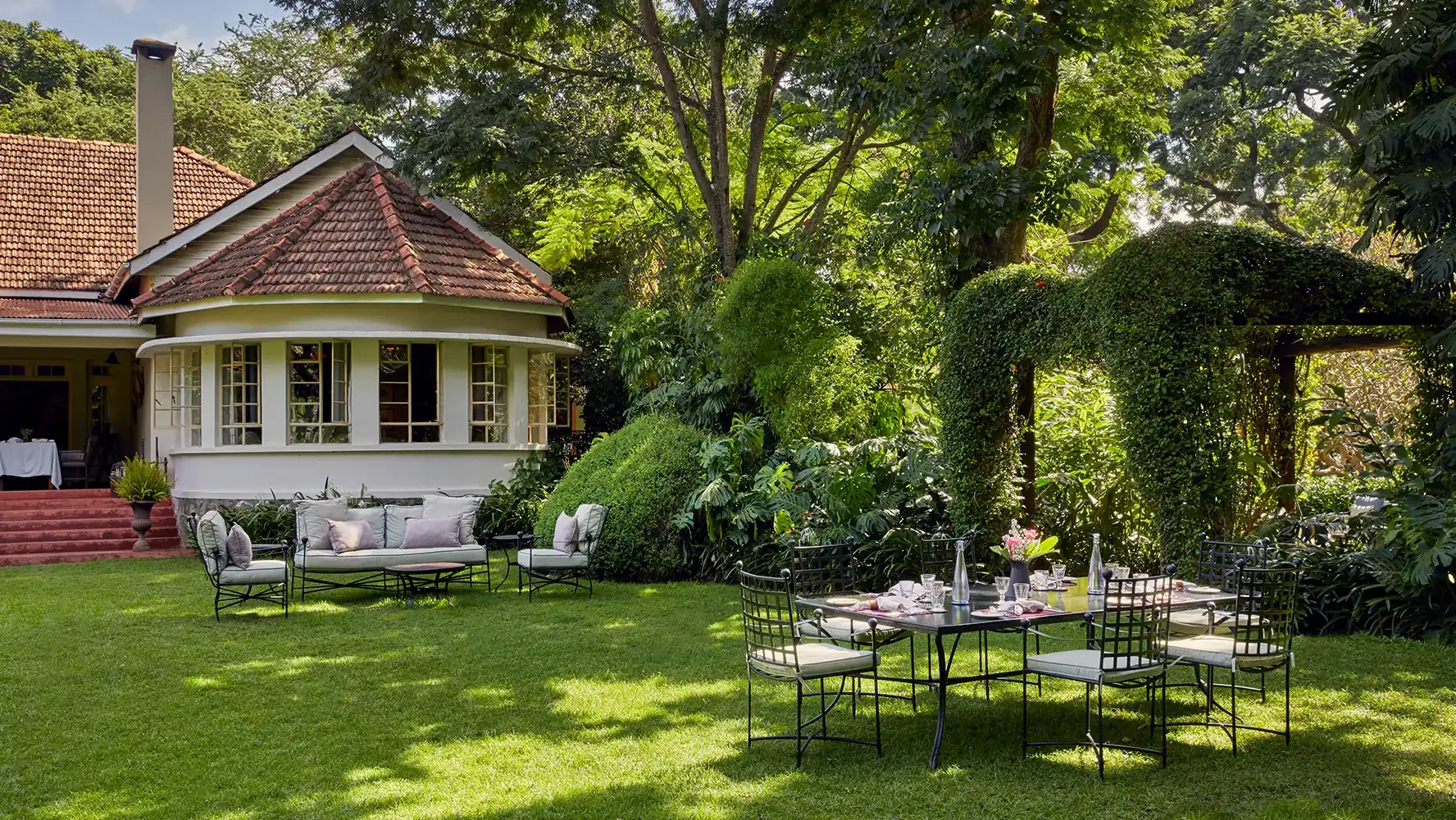 A cottage with tables set out on the lawn