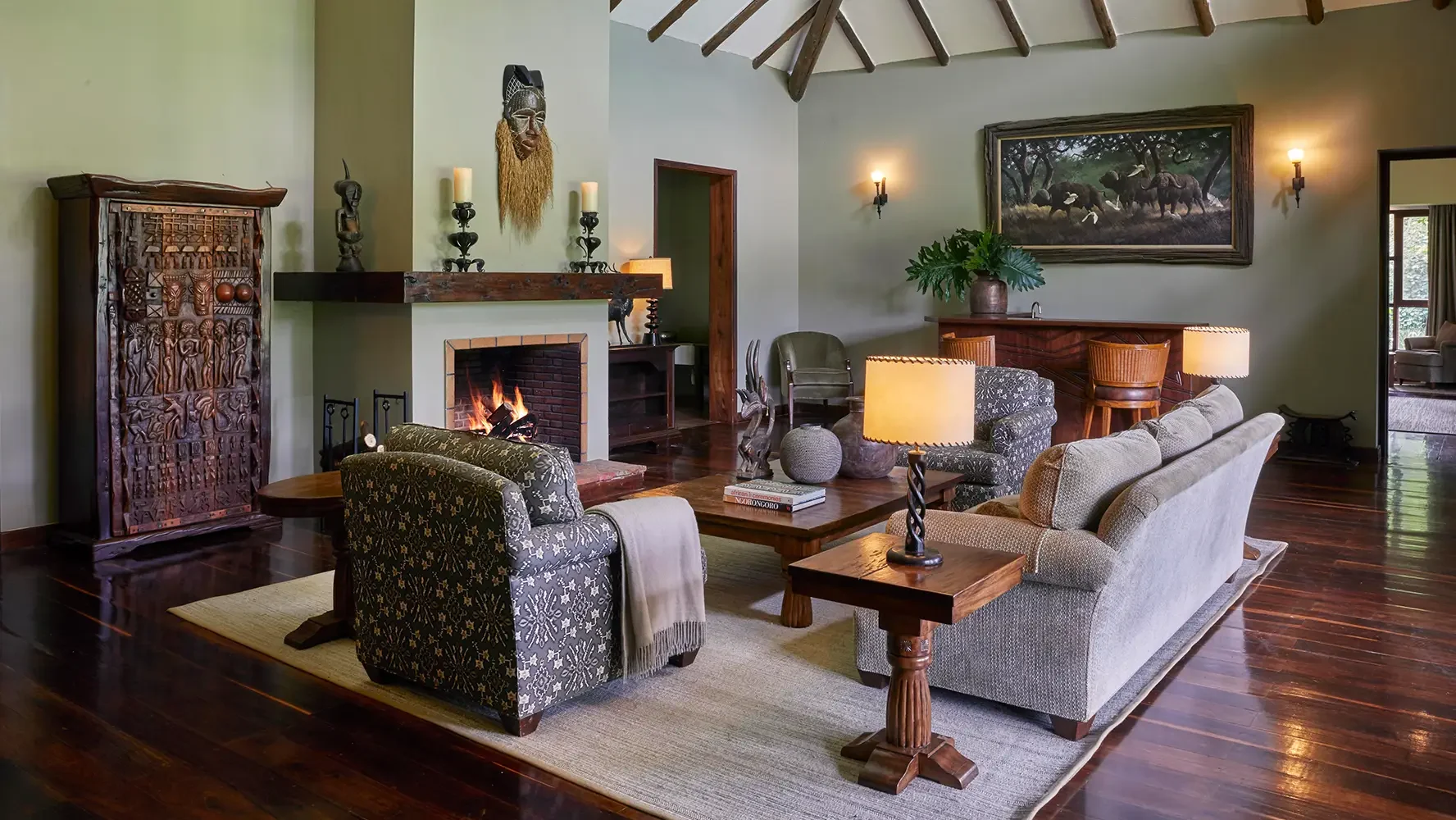 The lounge with a fireplace and armchairs