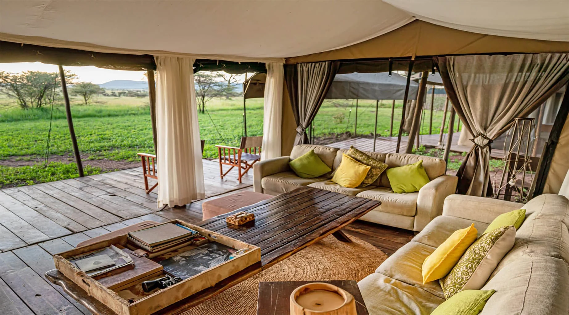 The lounge tent with its sides open to the plains