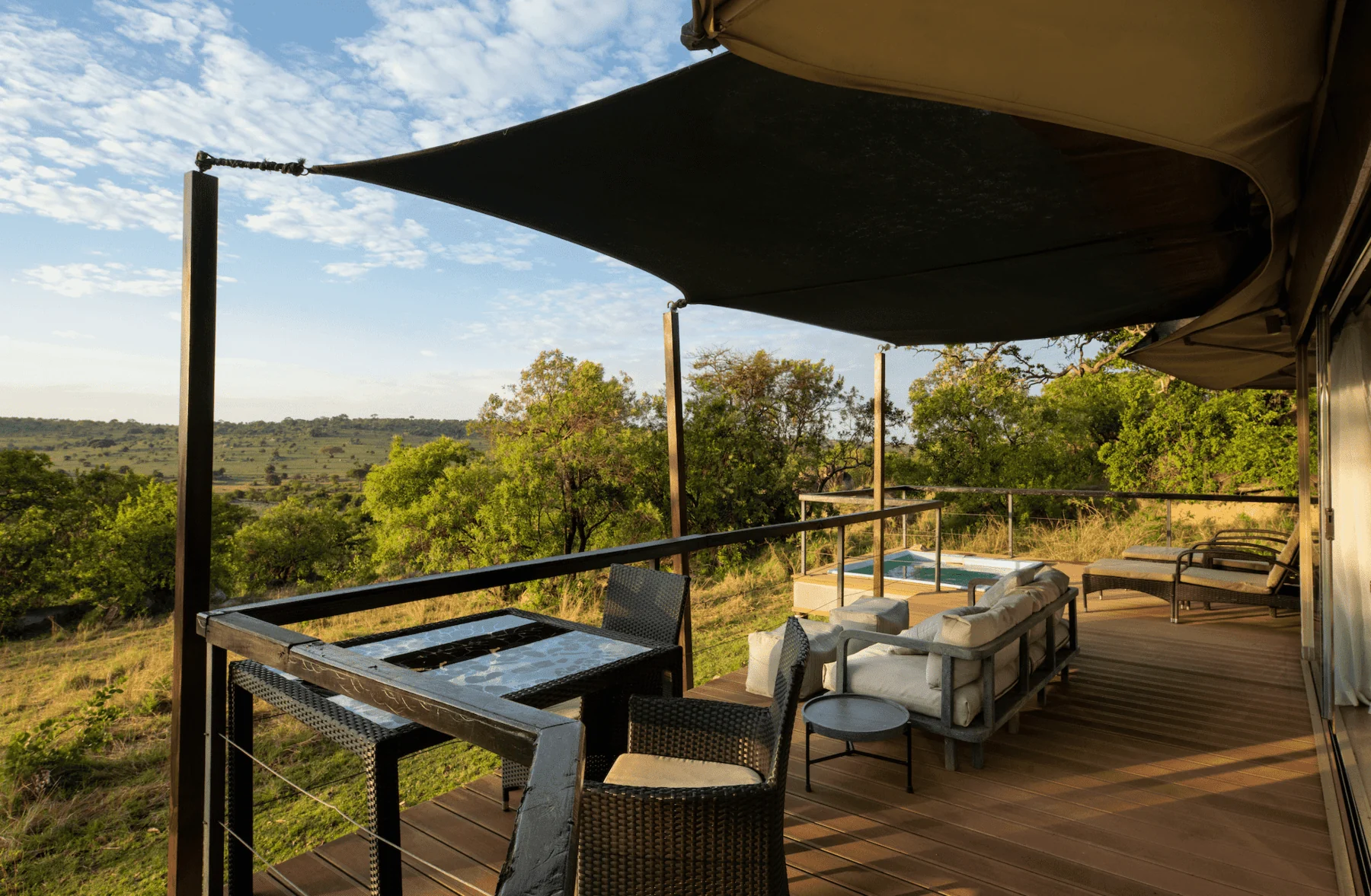 A suite deck with its plunge pool and loungers
