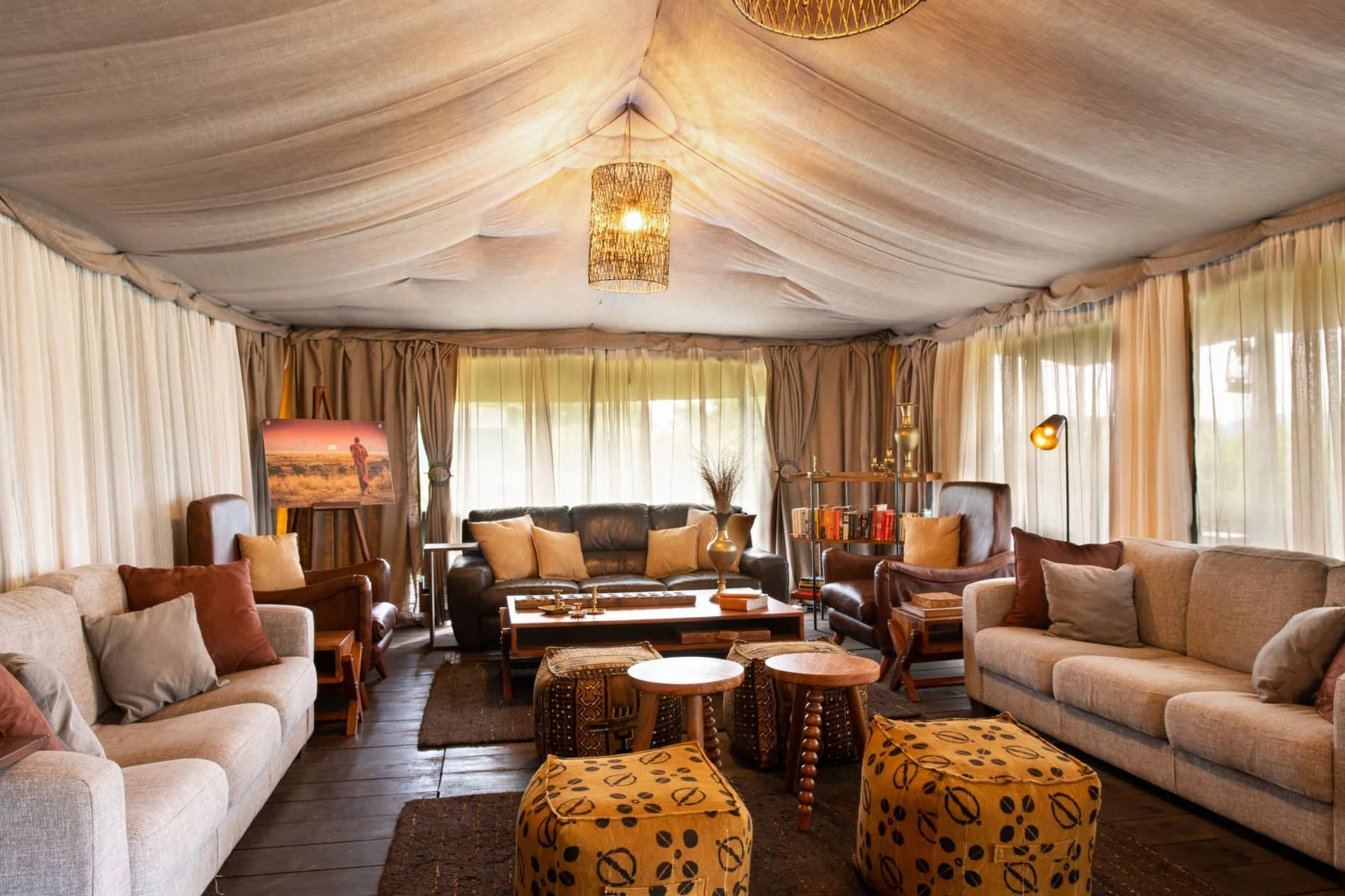 The lounge tent with sofas and patterned stools
