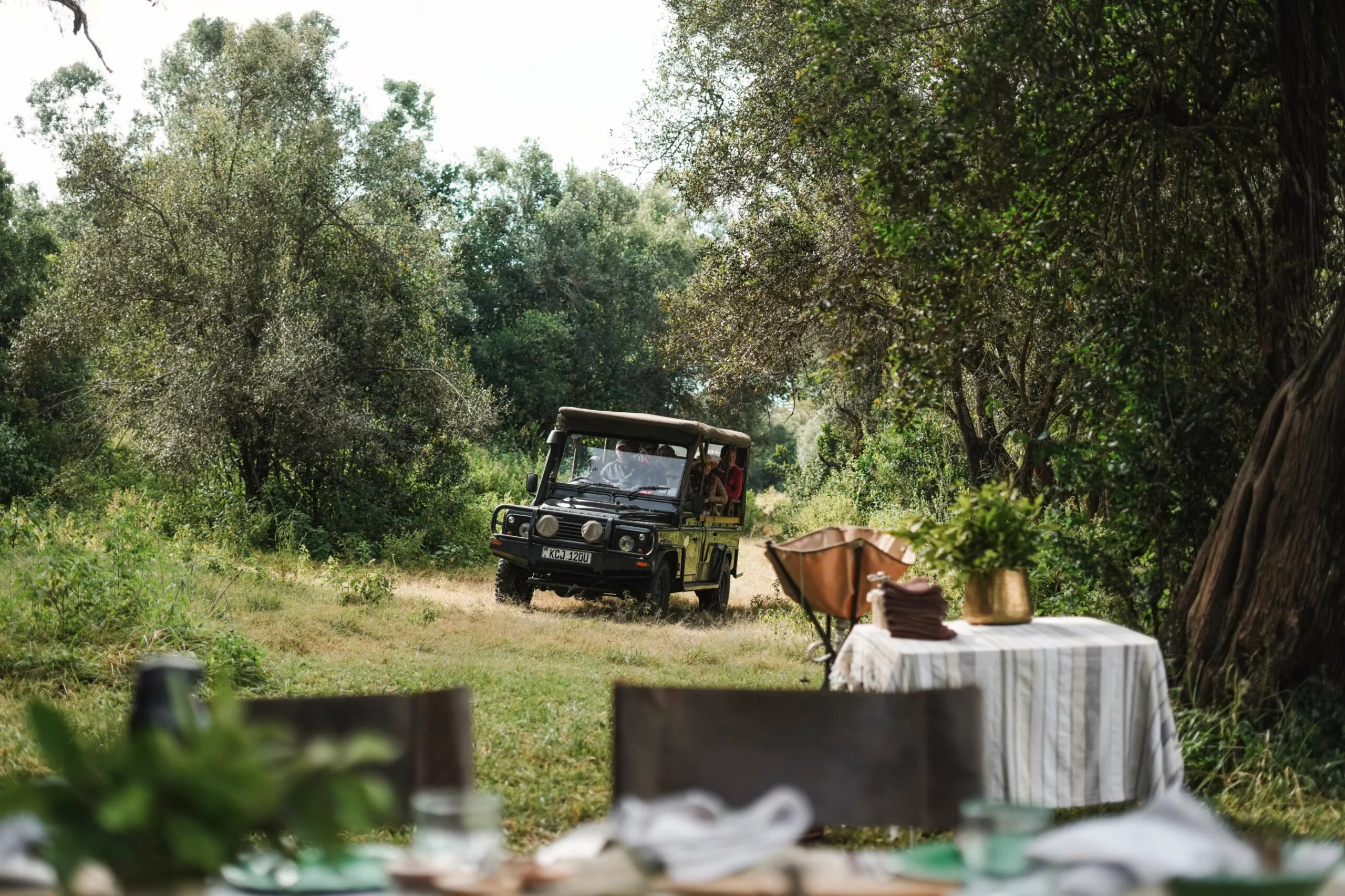 A safari vehicle stopped for a bush breakfast
