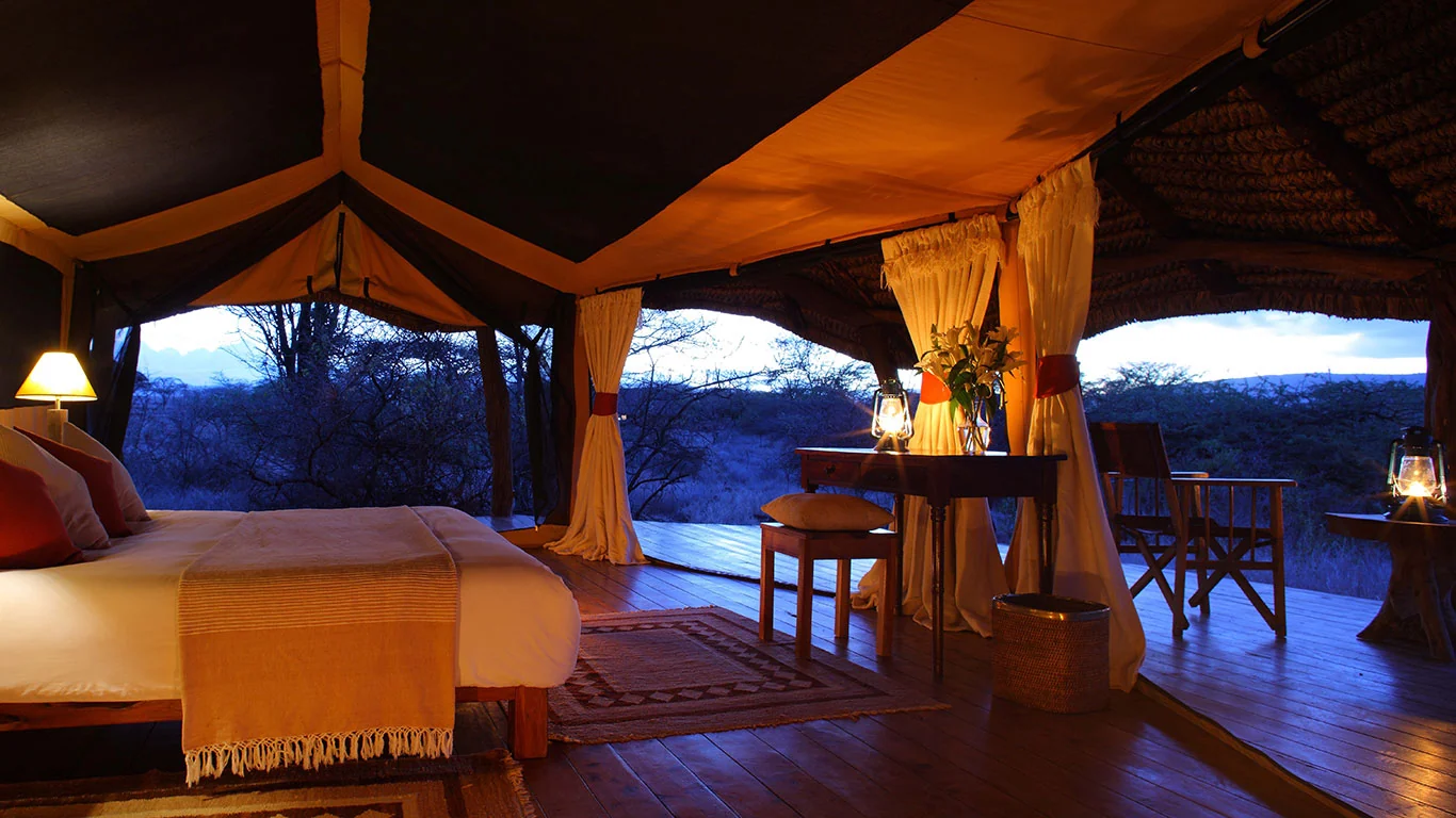 A tent bedroom at dusk