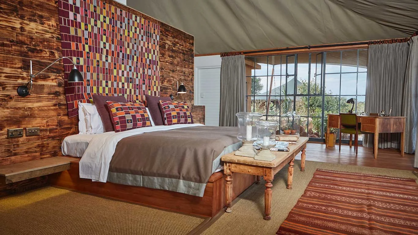 A bedroom with a beaded wall panel