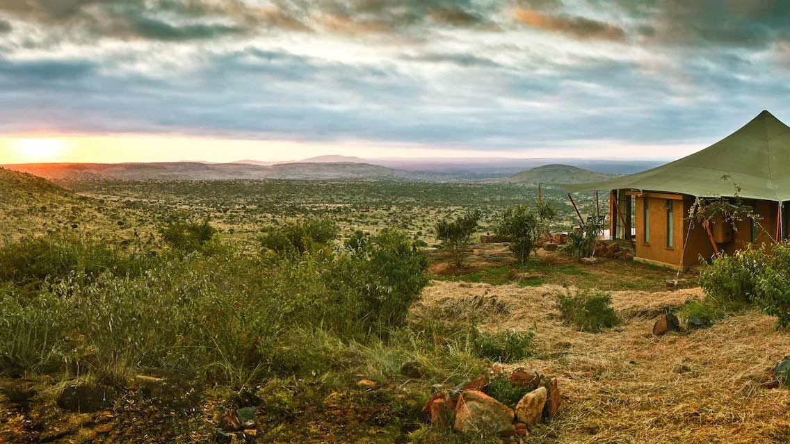 A tent above the valley at sunset