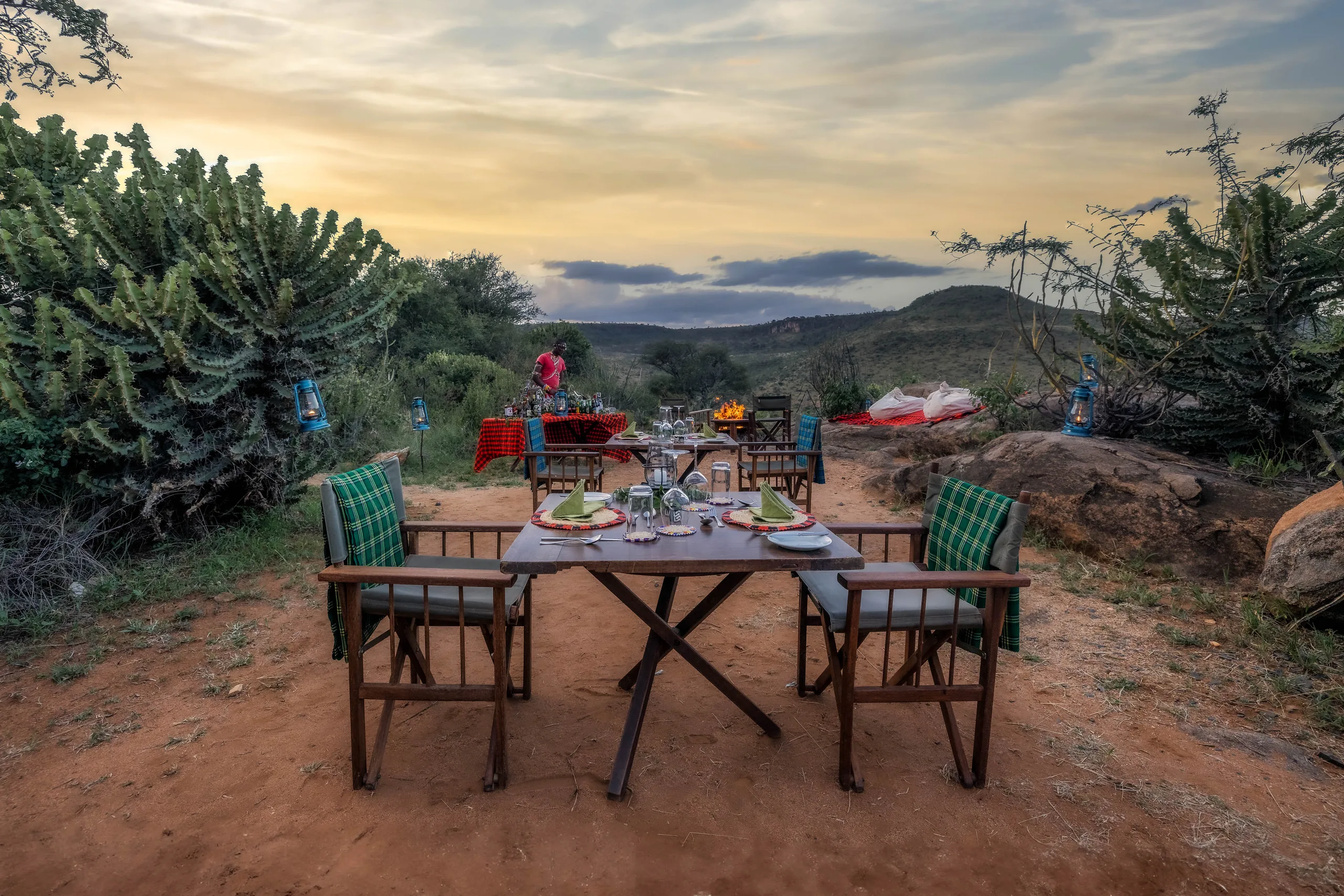 An outdoor dinner table overlooking the landscape at Loisaba Star Beds