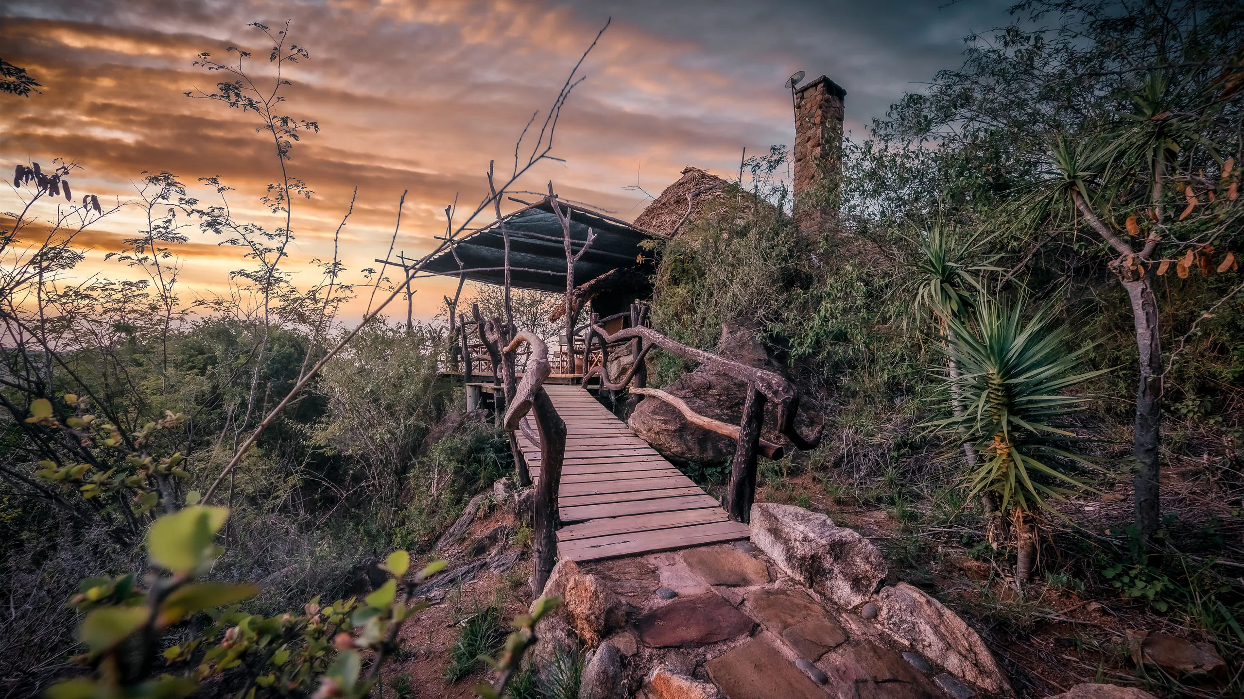 A timber walkway approaching the main house at Loisaba Star Beds