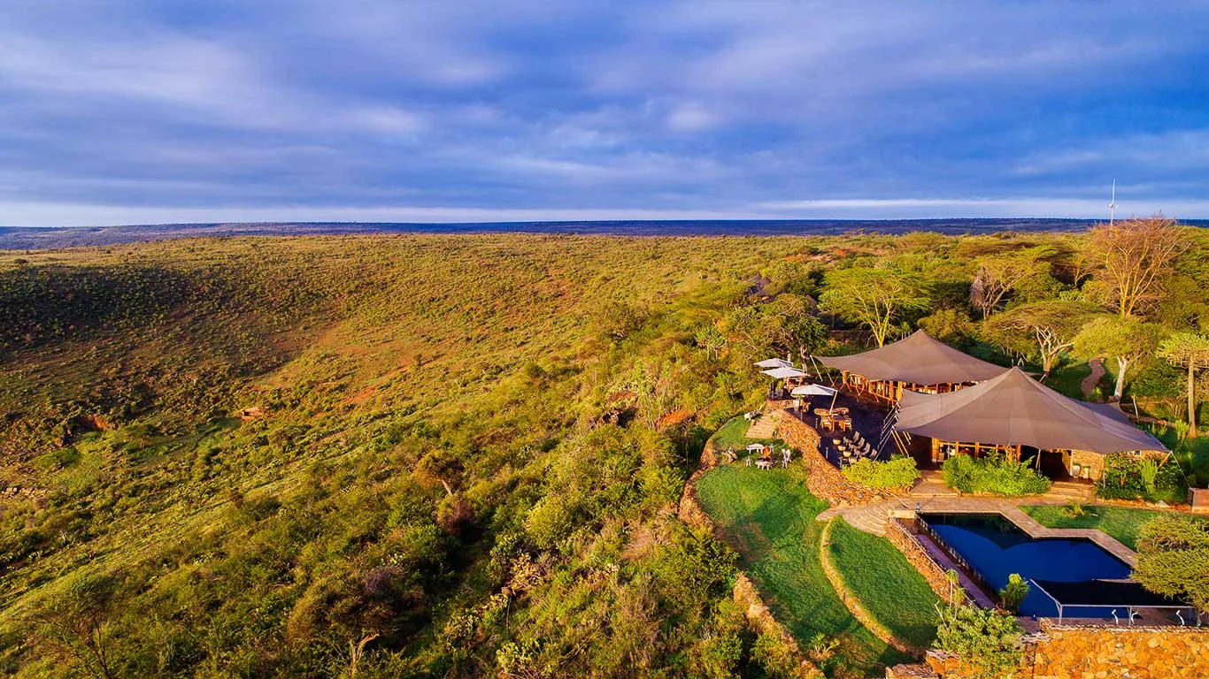 The camp and its pool on the escarpment, from the air