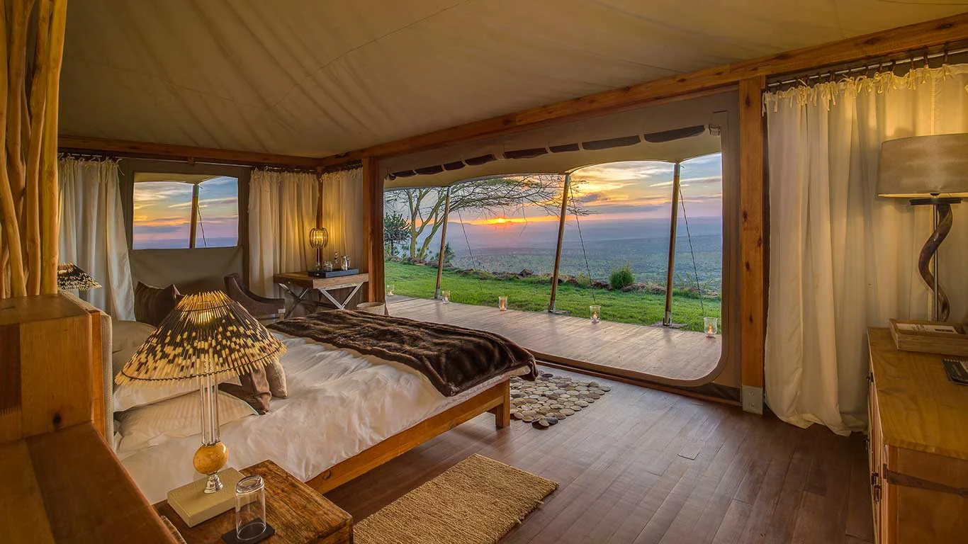A tent bedroom looking out over the valley