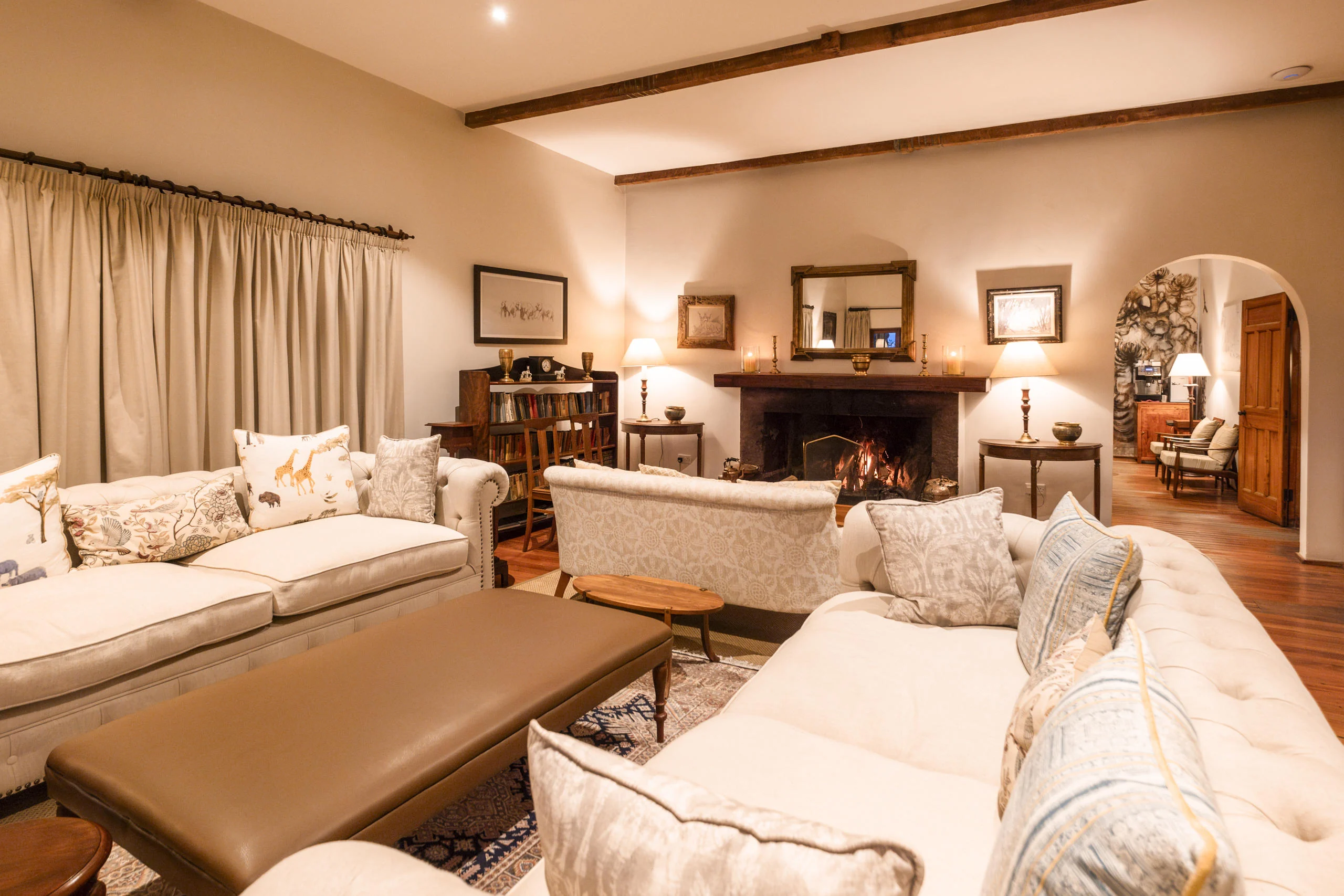 The sitting room with sofas and a fireplace