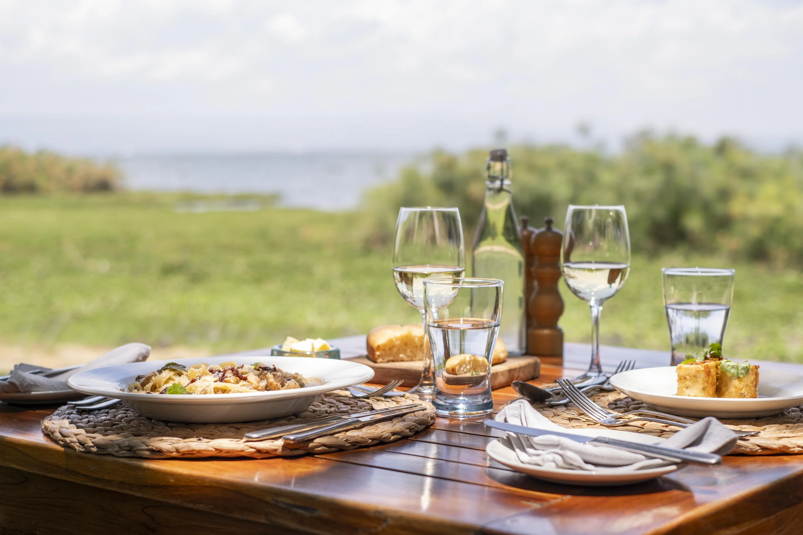 Lunch laid on a table with the lake beyond