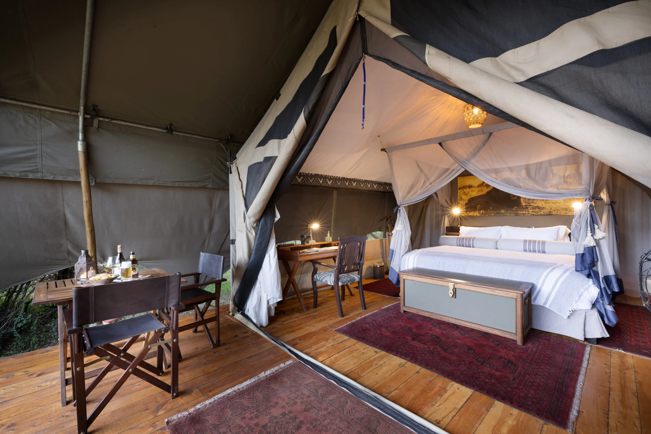 A tent interior with a writing desk