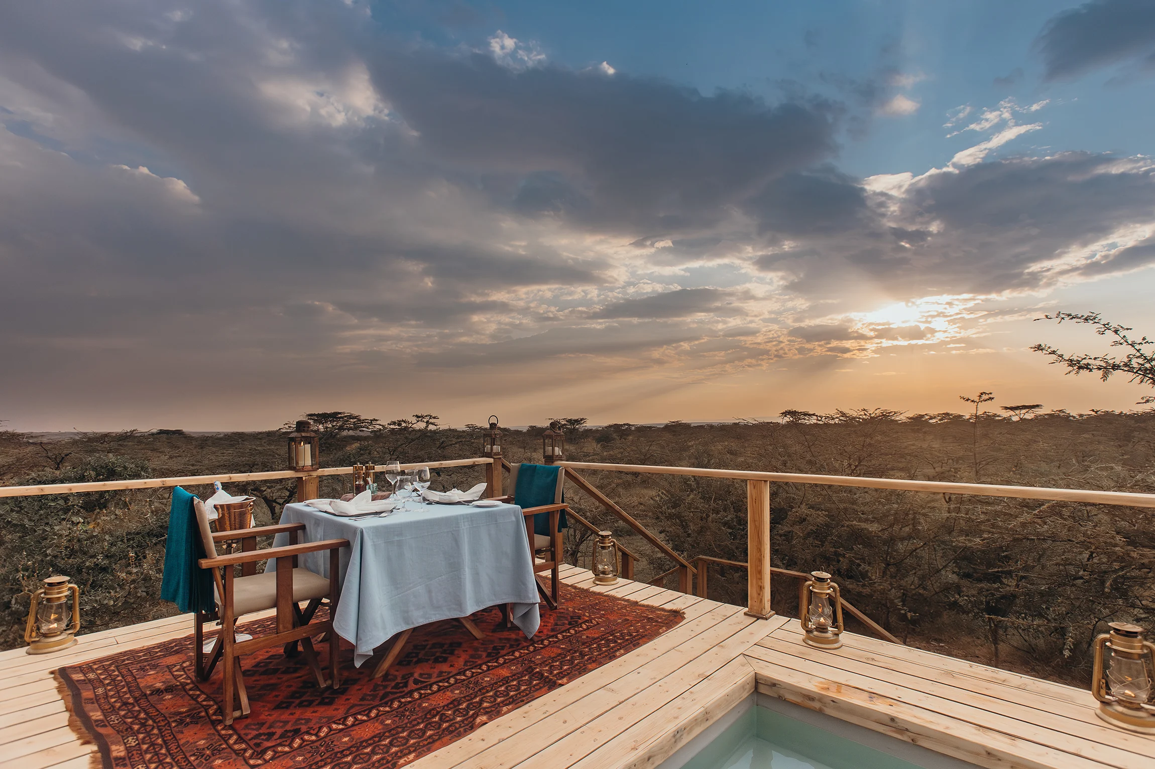 A table on the pool deck above the plains