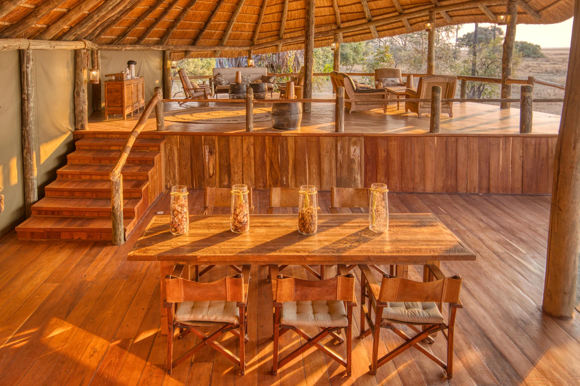 The dining area under thatch with timber tables