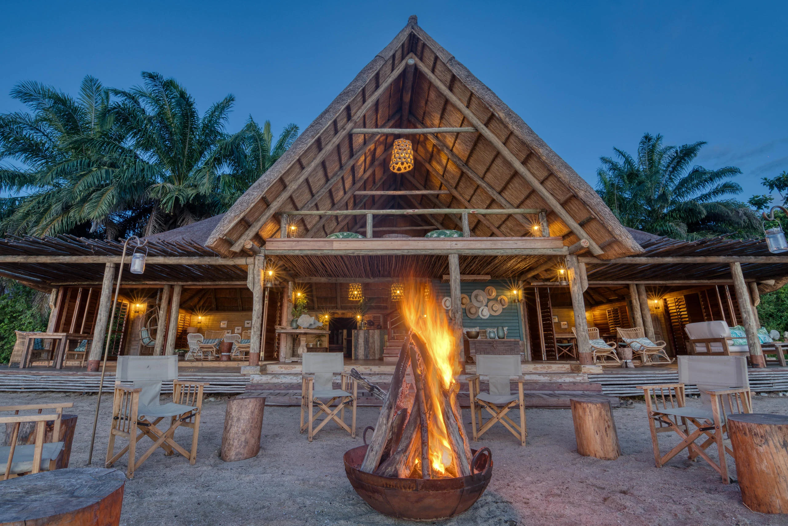 The main banda with a fire lit at dusk