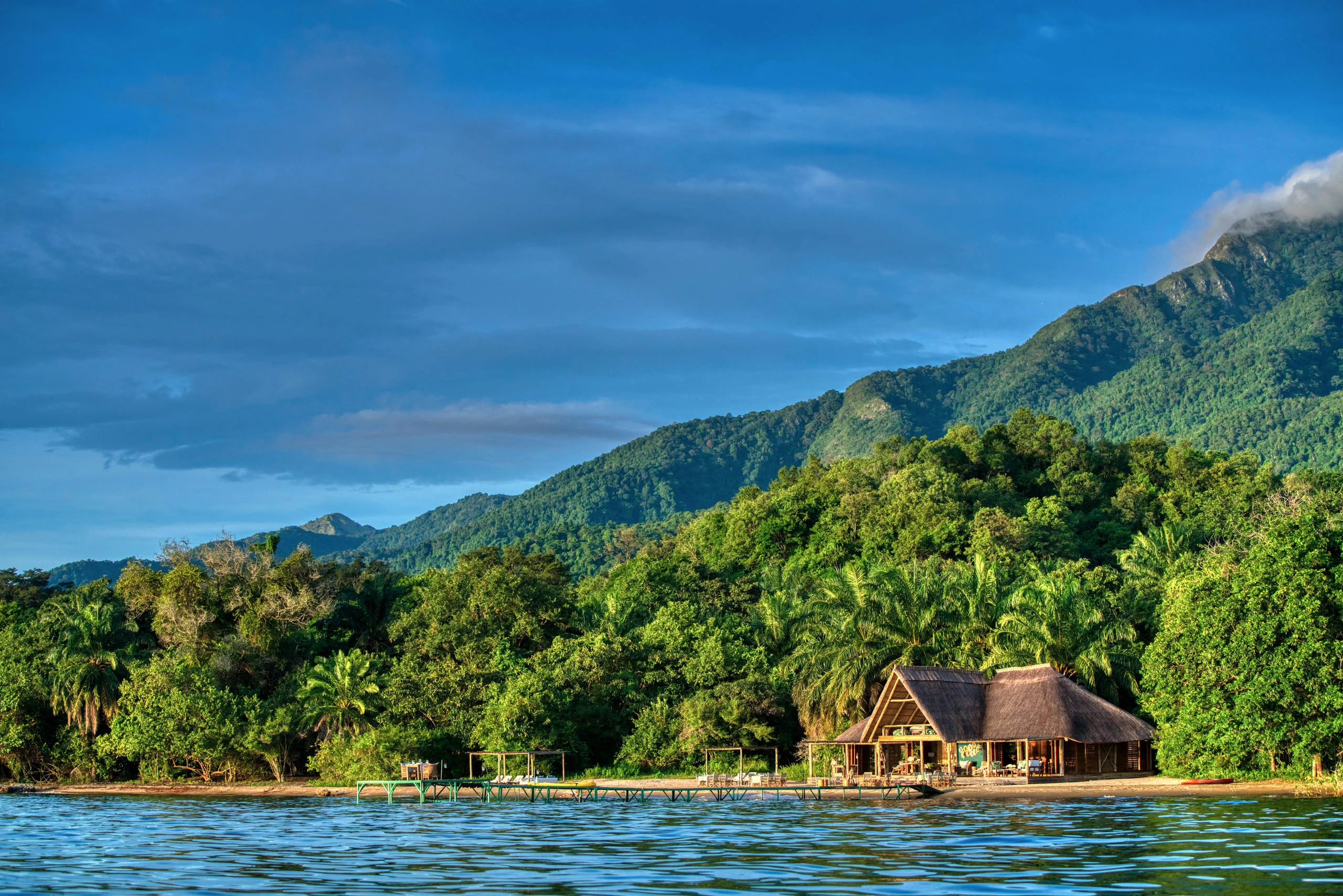 The lodge on the lakeshore beneath the mountains