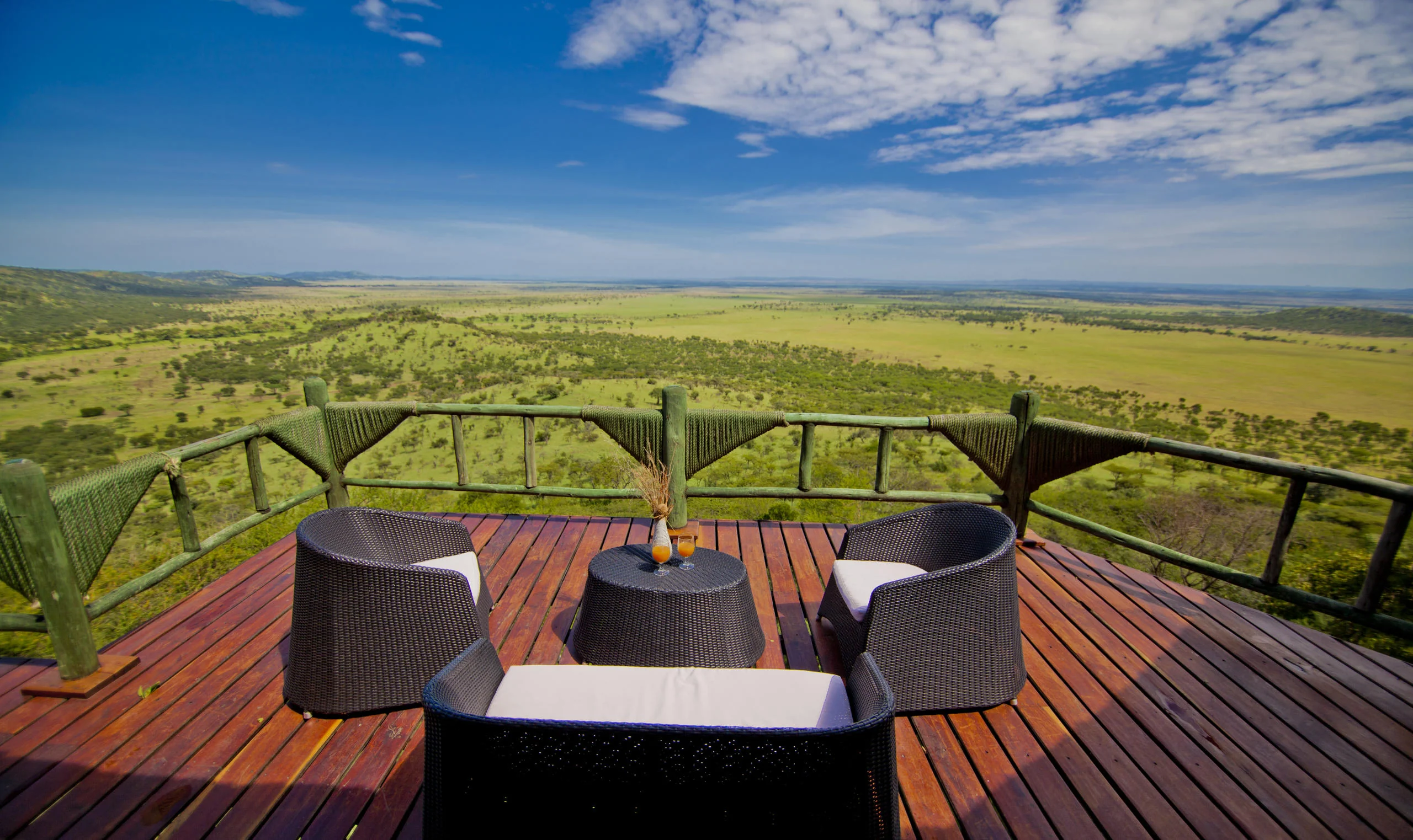 A deck with chairs looking over the plains