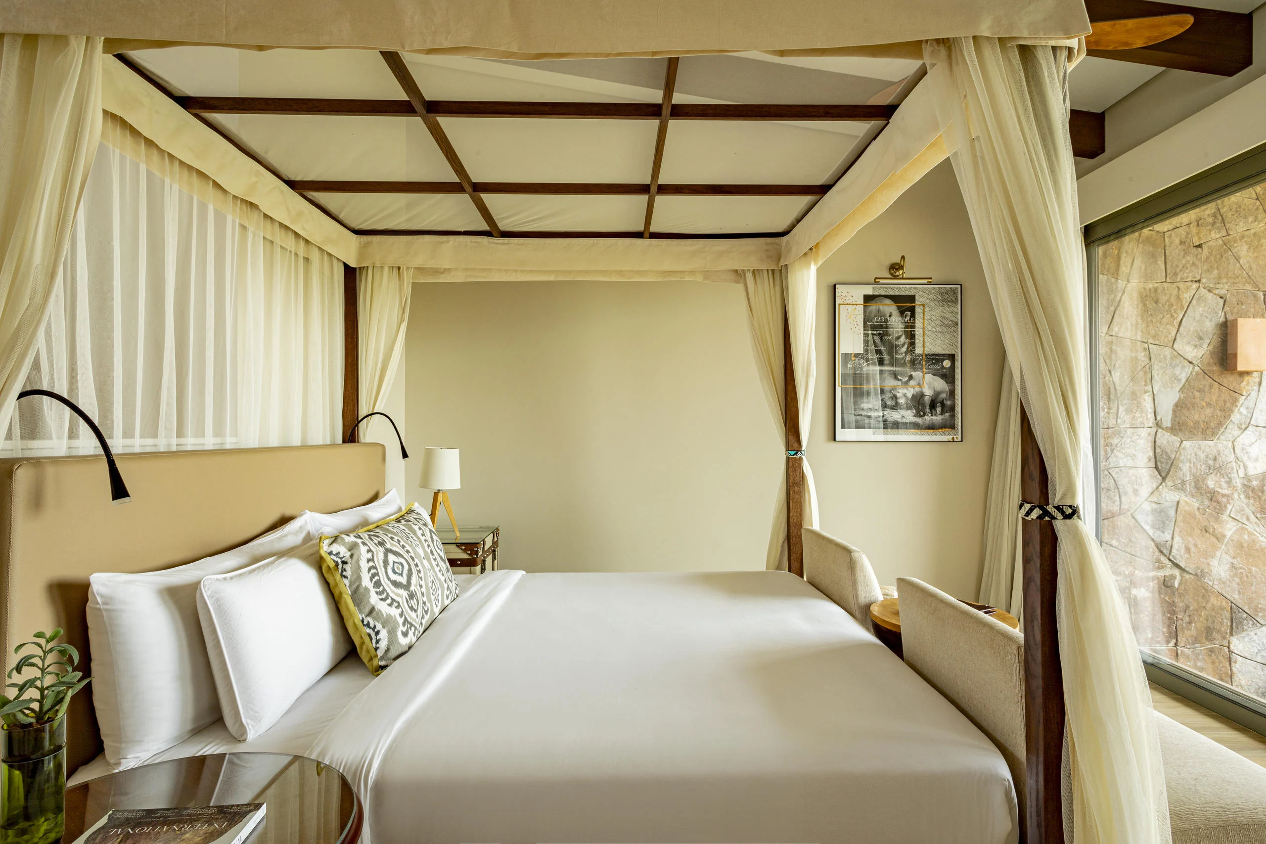 A bedroom with a four-poster bed