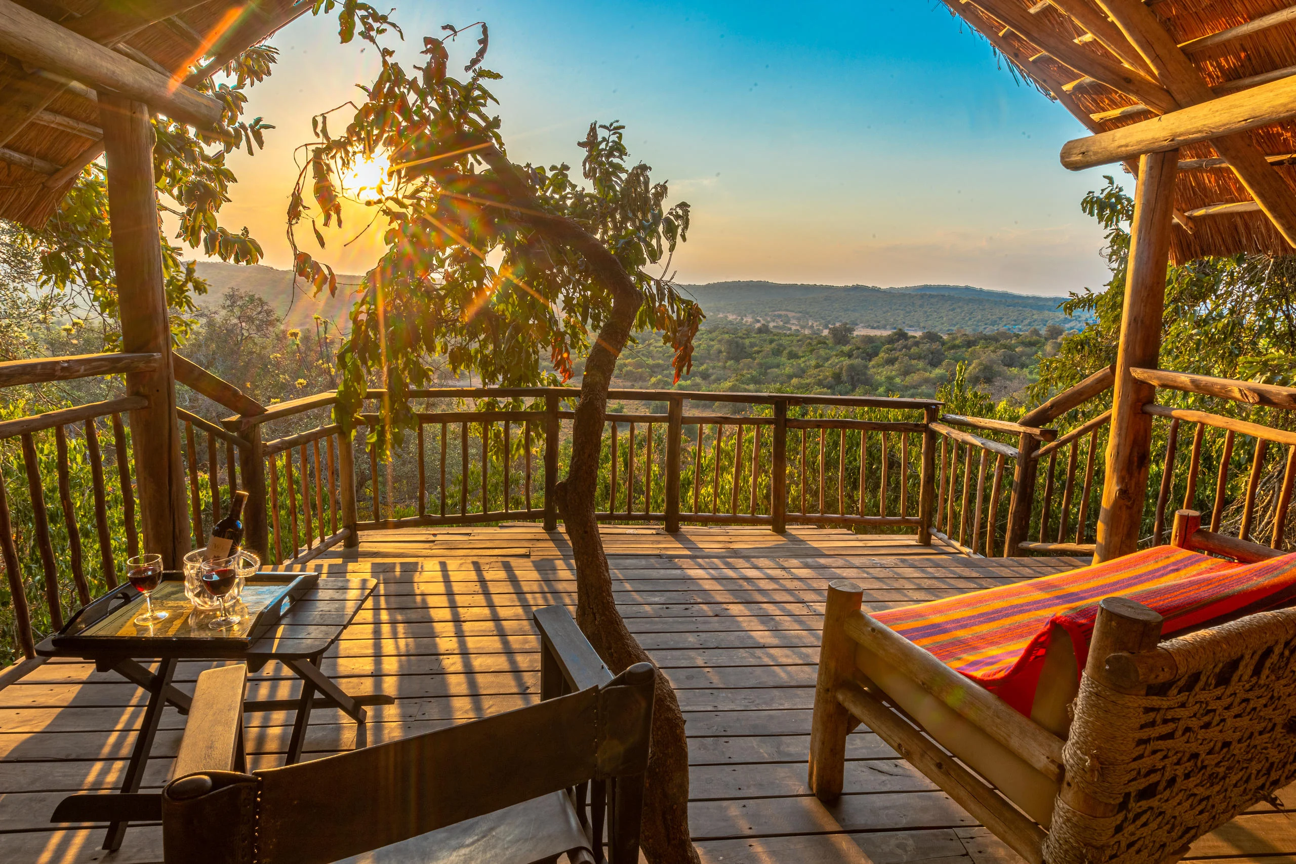 A banda deck looking out over the savannah at sunrise