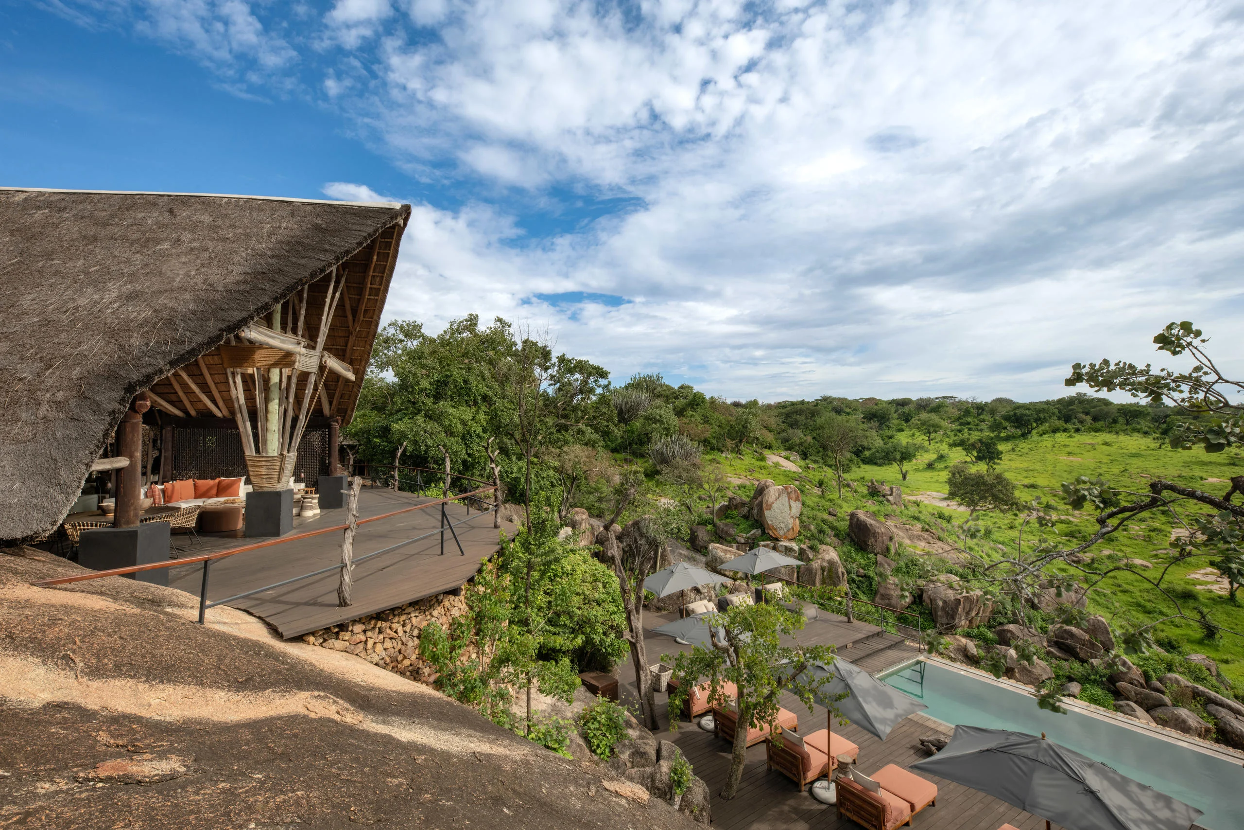 A thatched suite on the rocks above the river