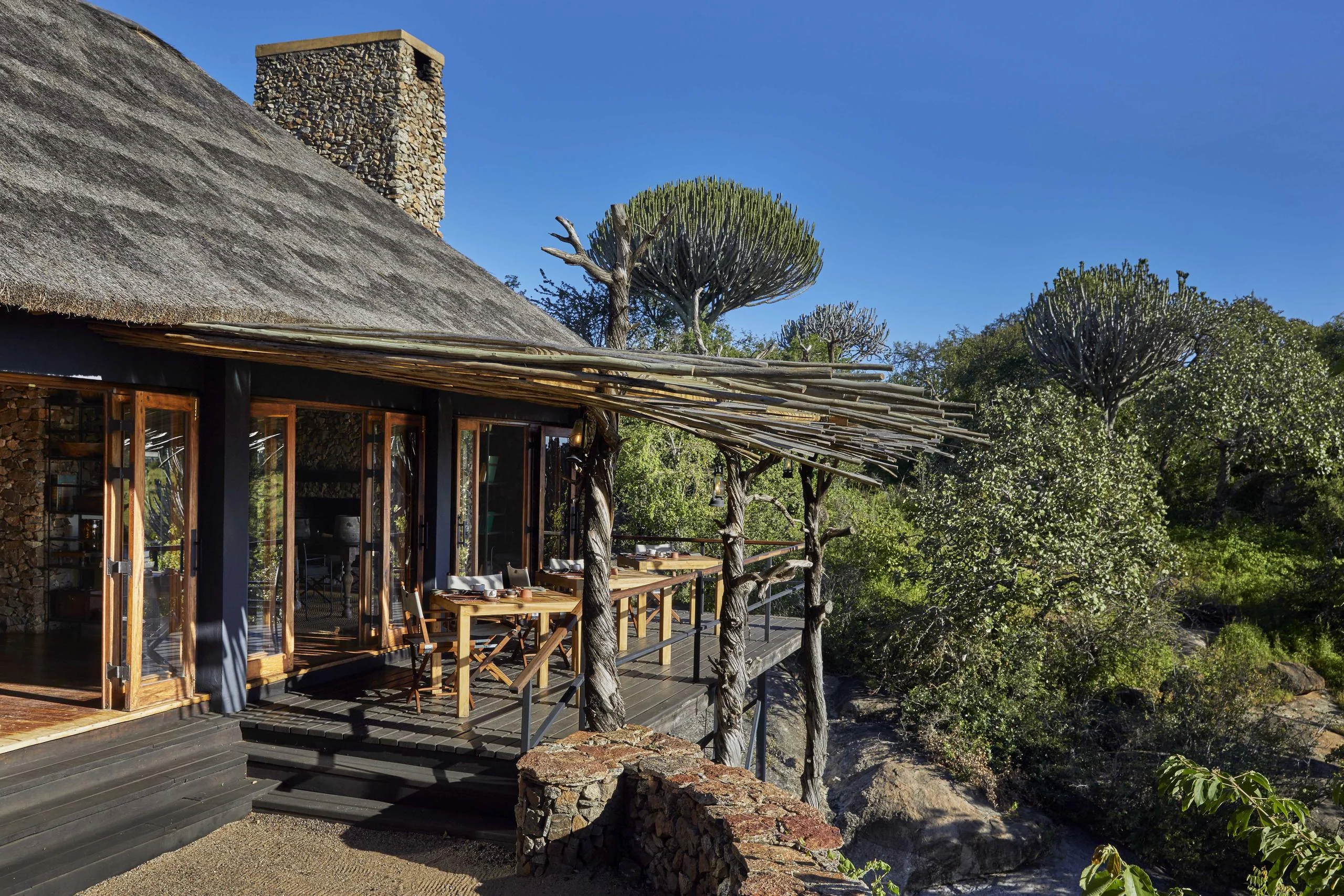 A stone and thatch suite with its deck
