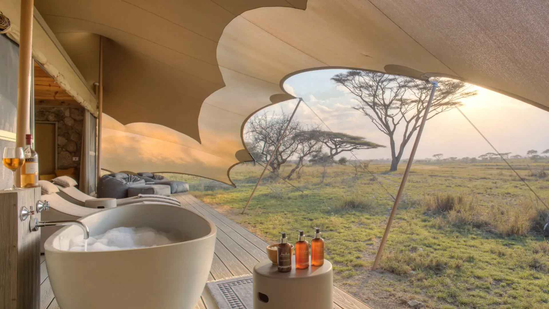 A bath in a tent with the plains beyond