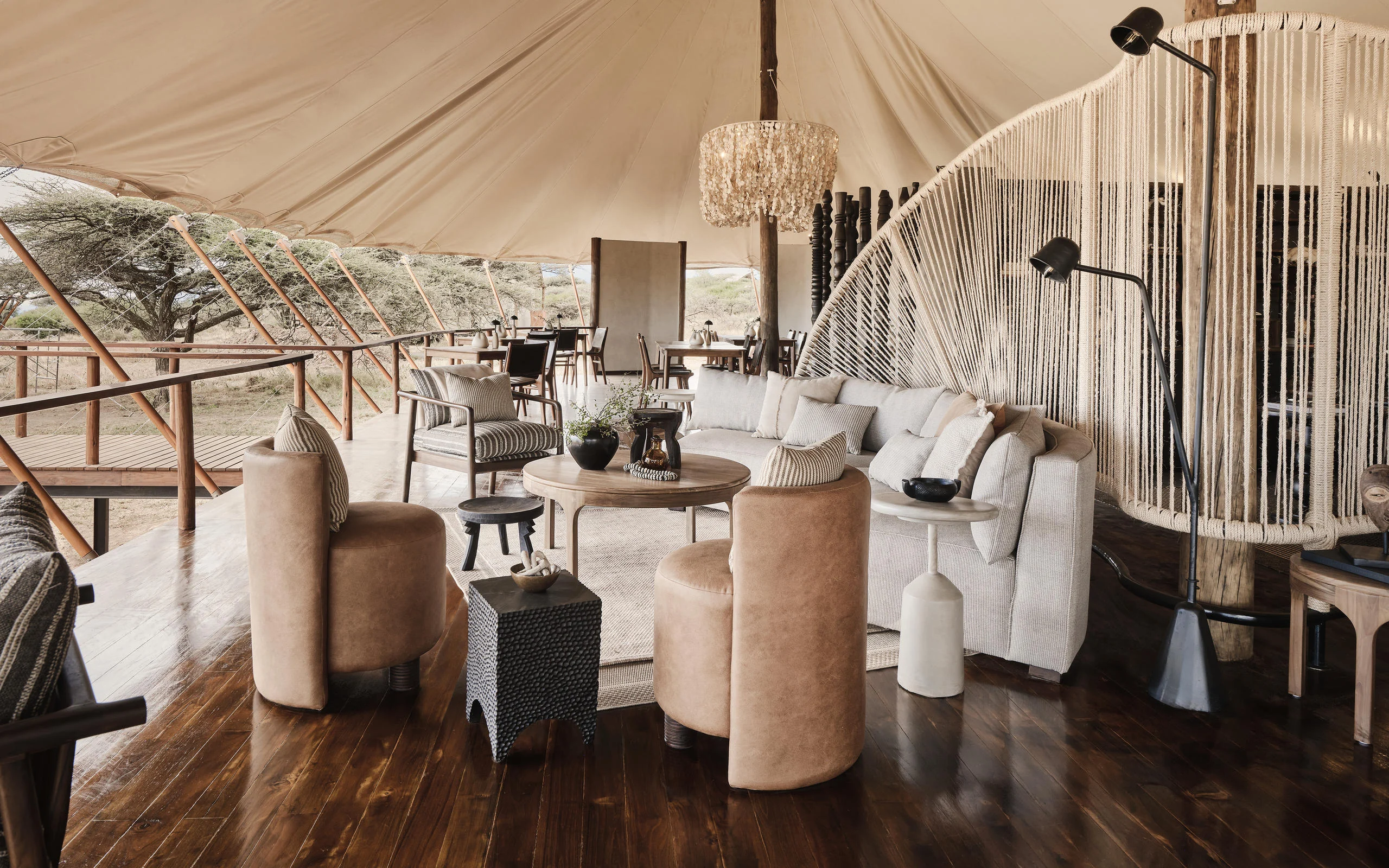 The lounge tent with sofas and a timber floor