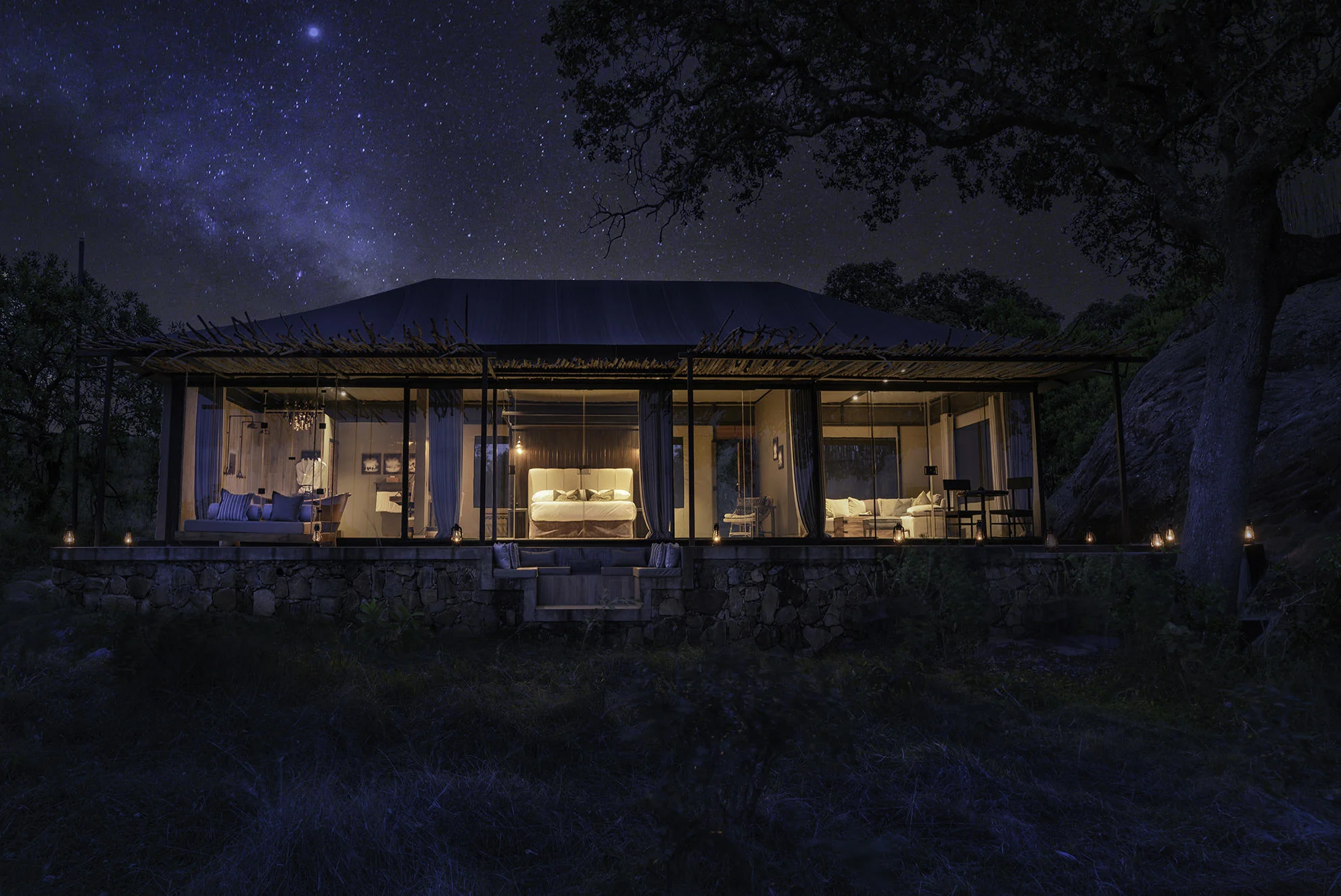 A suite lit at night under the stars