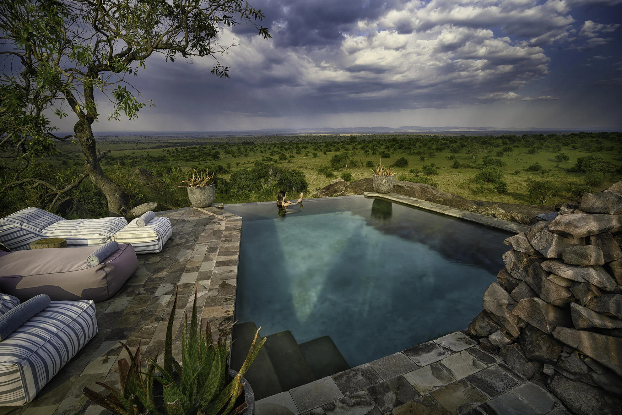 The pool set among the rocks with the plains beyond