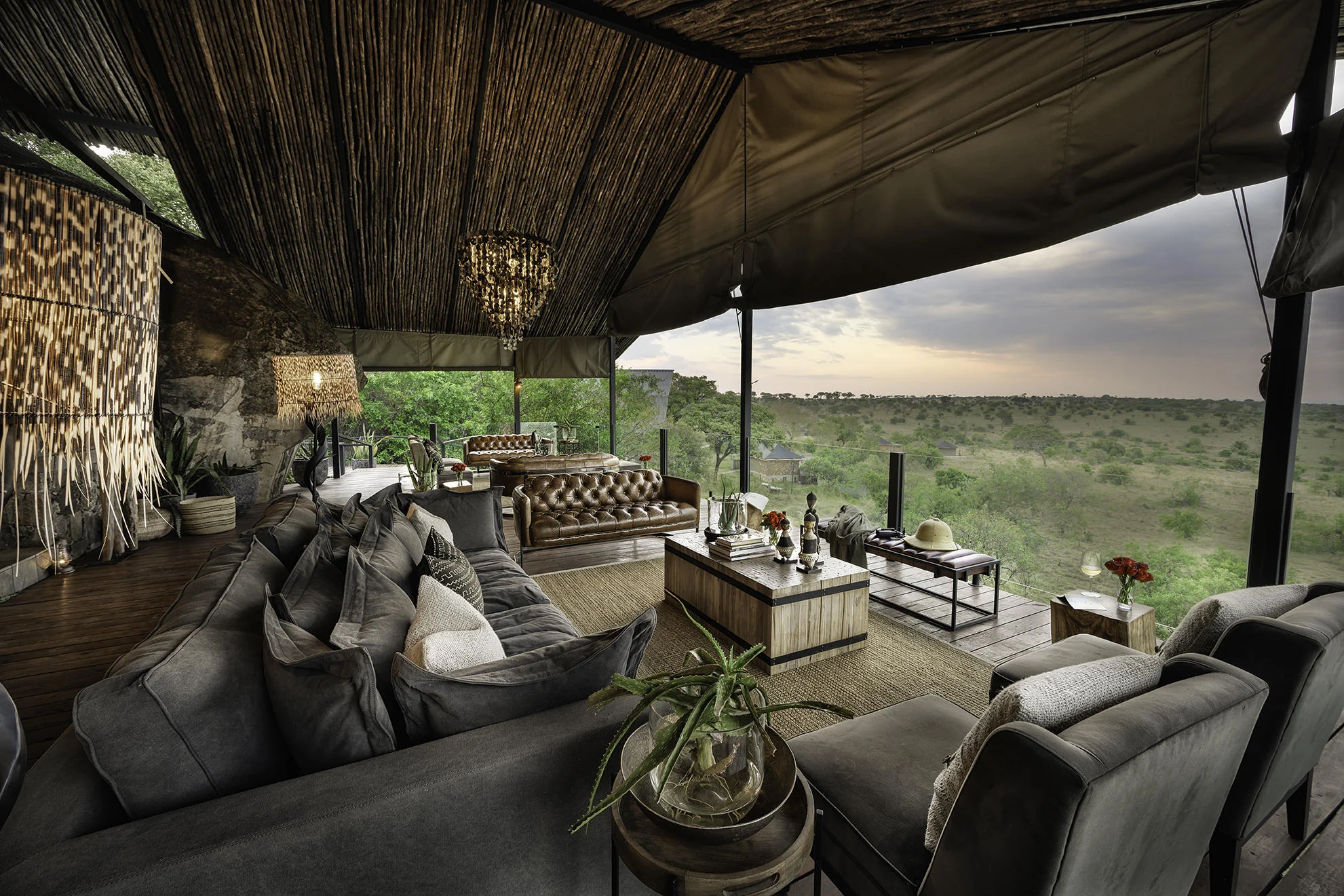 The lounge with sofas beneath a woven ceiling