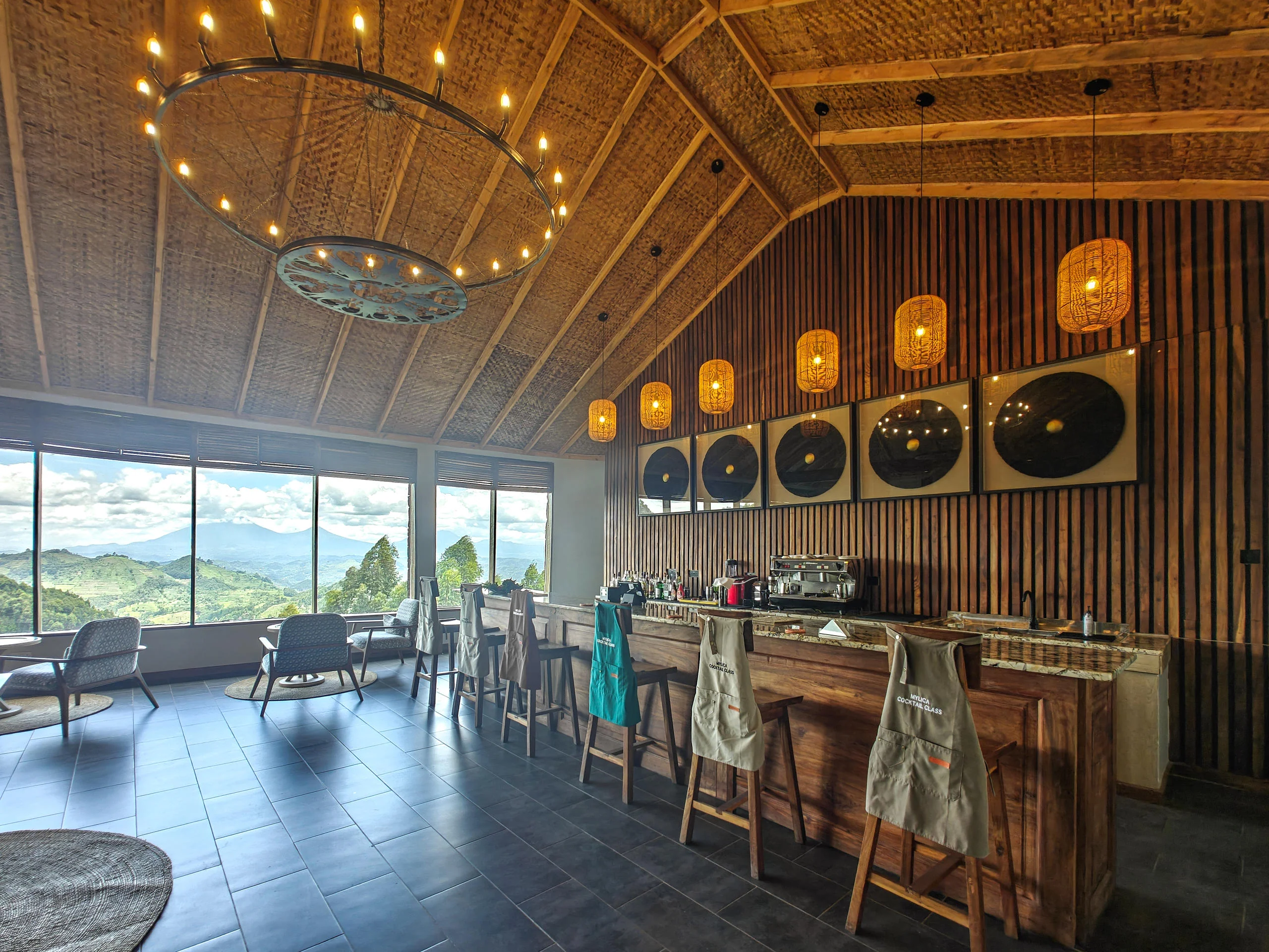 The bar with woven panels and a view over the hills