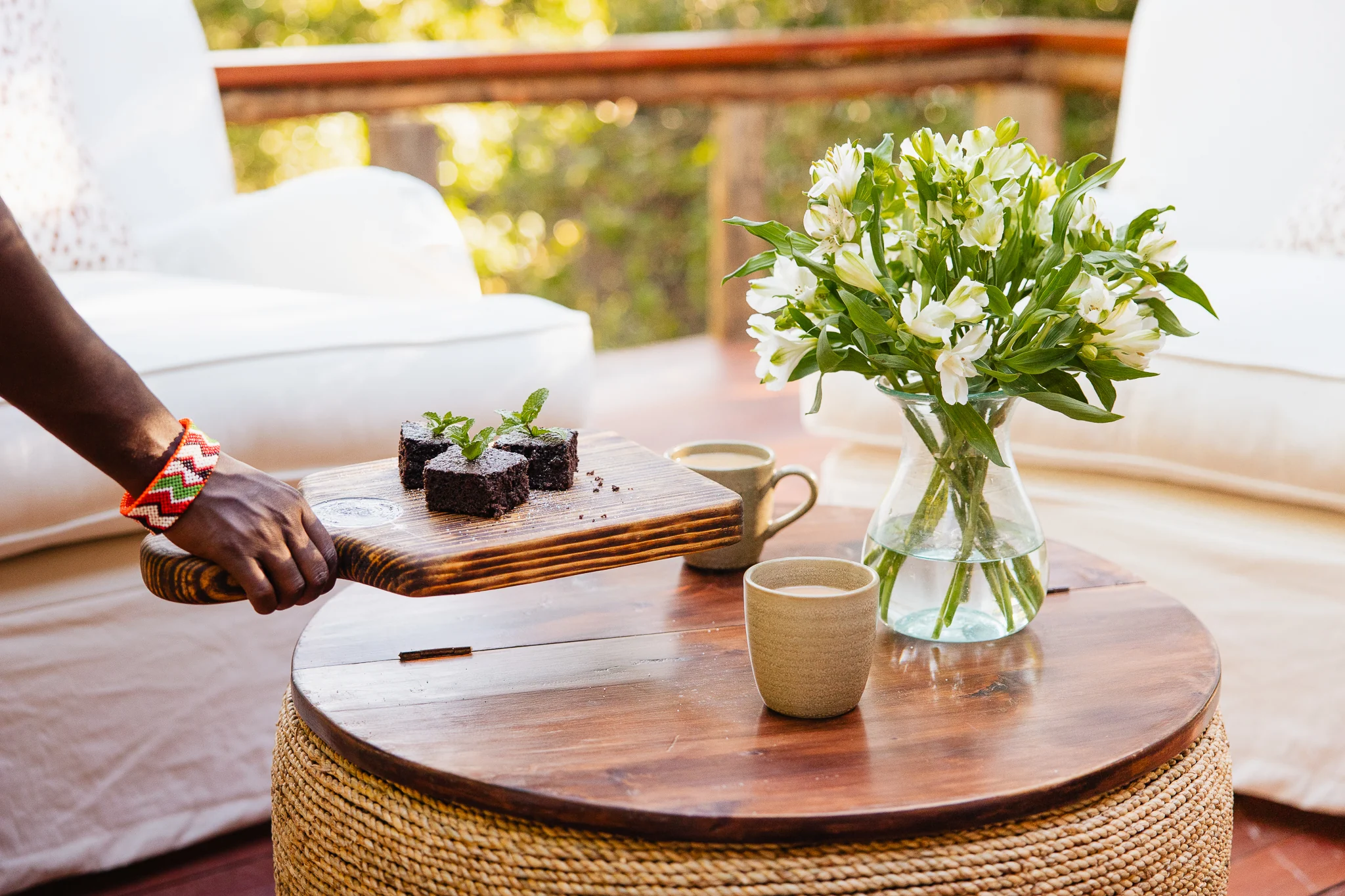 Coffee and flowers on a side table