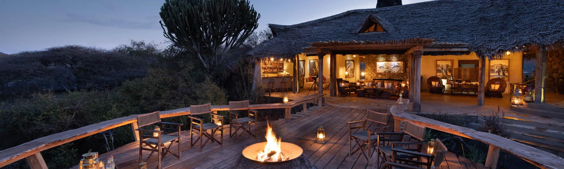 The lodge deck and fire pit at dusk