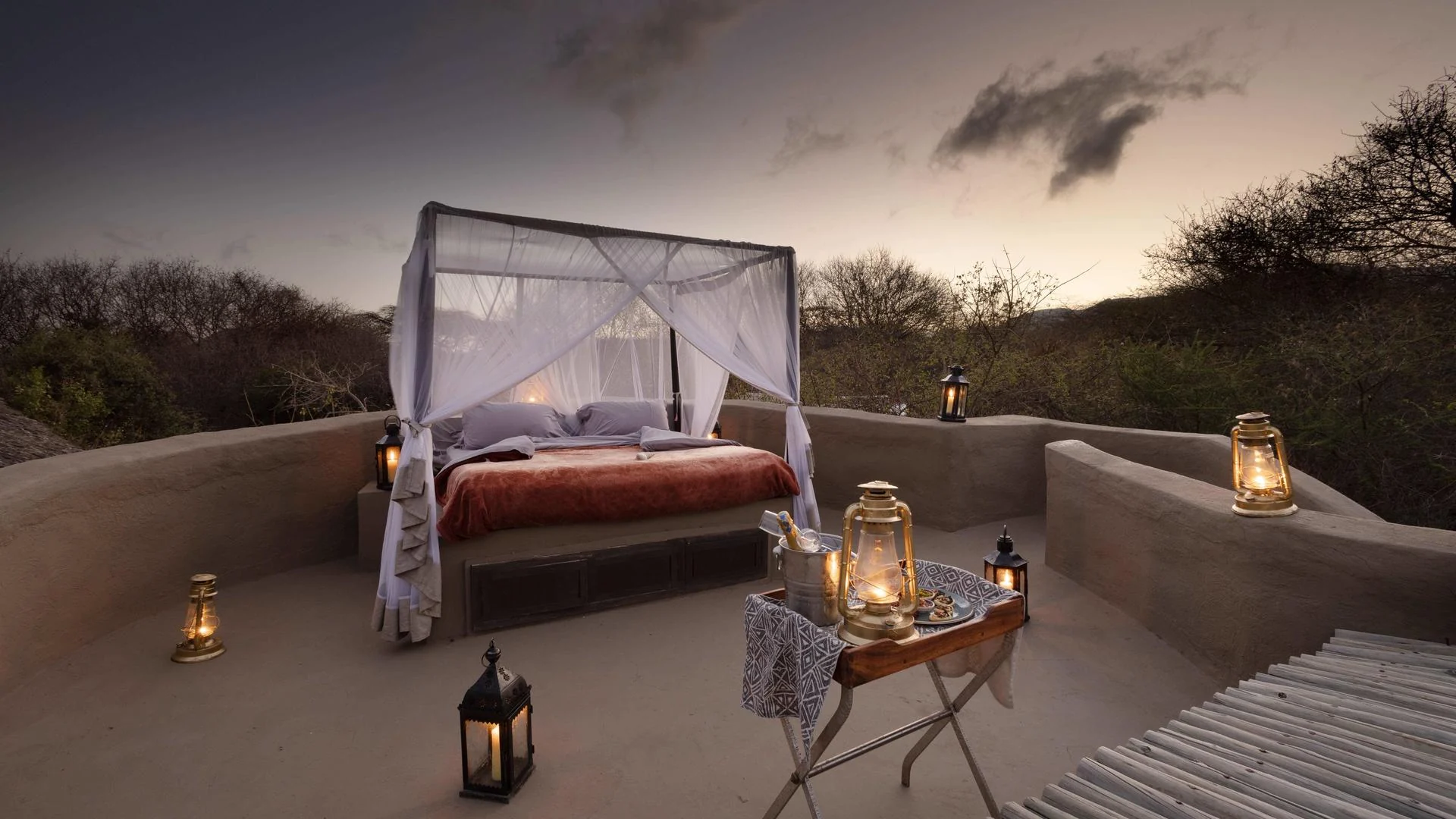 A star bed on a rooftop at dusk