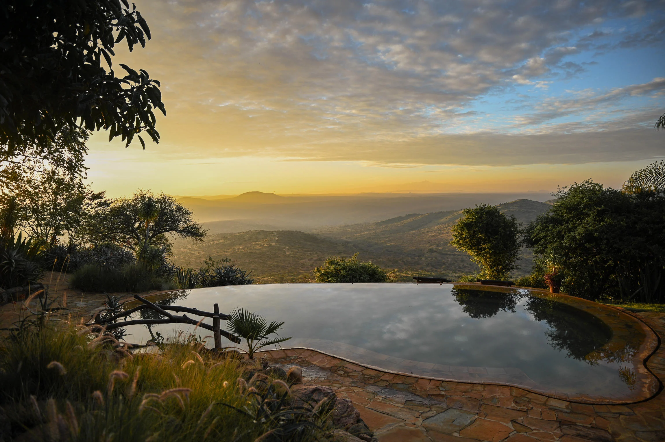 The pool looking out over the valley at sunset