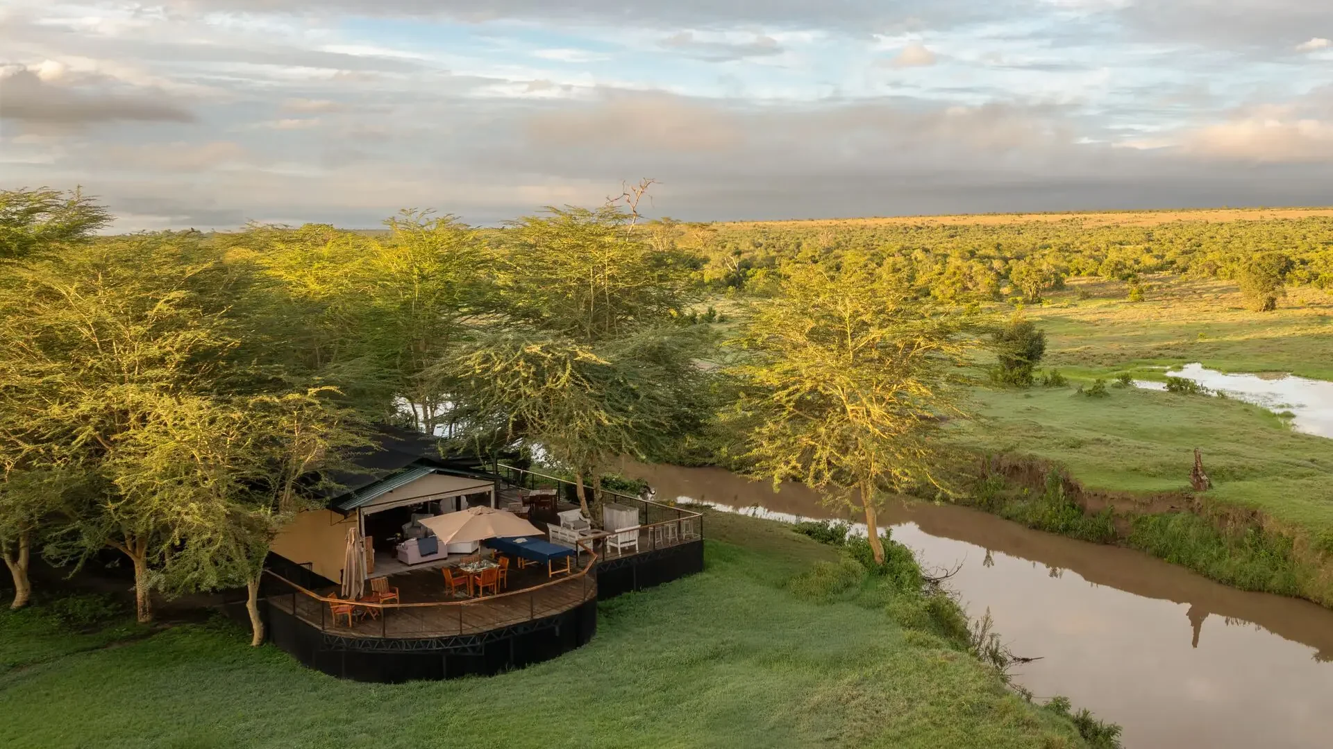 The camp's tents beside the river