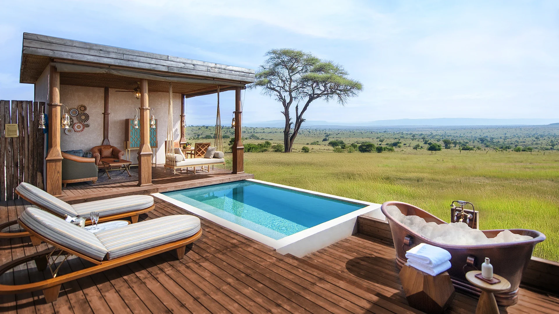 A suite deck with its plunge pool and daybed, looking over the plains